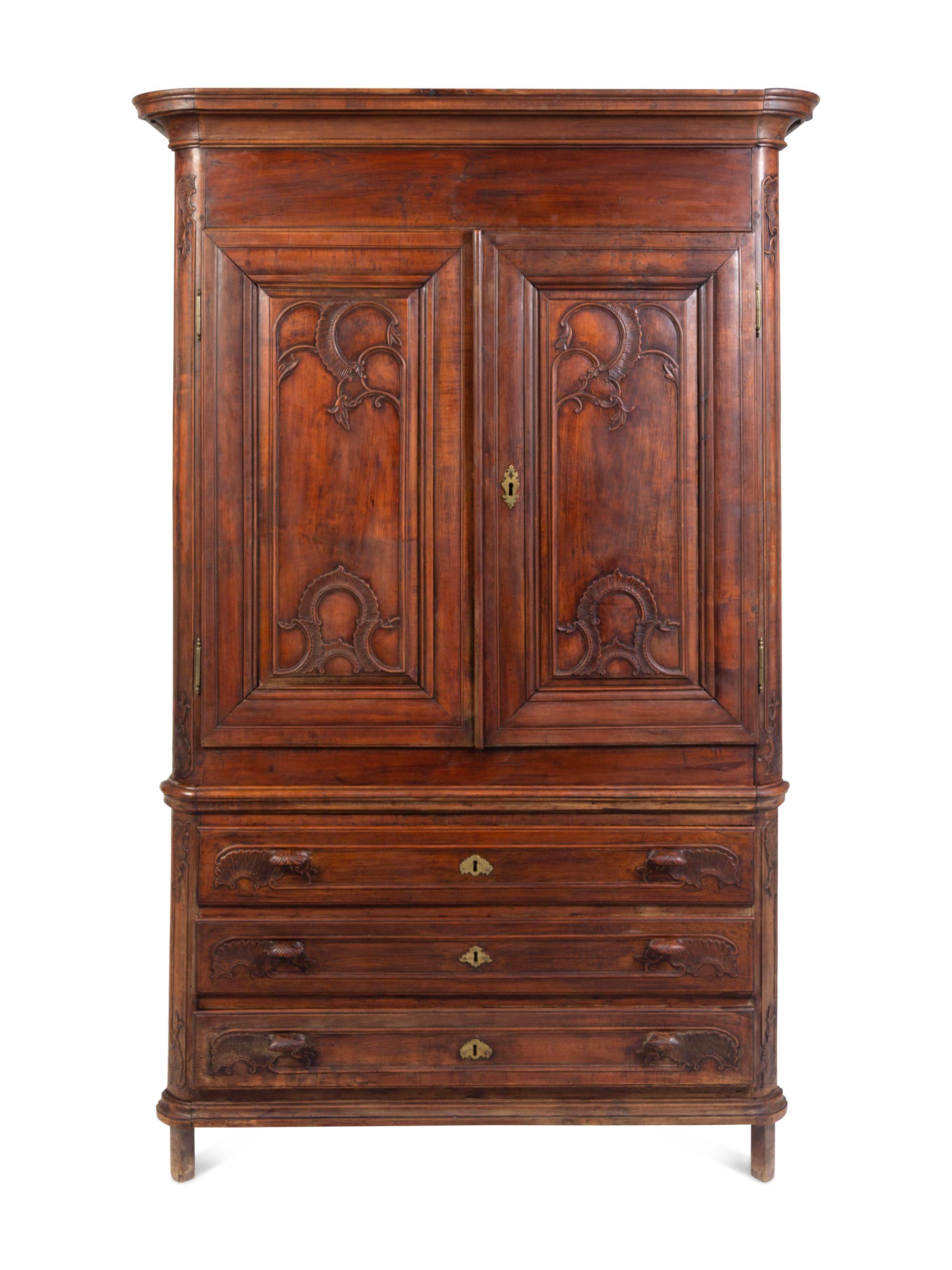 A Louis XV Carved Walnut Cabinet