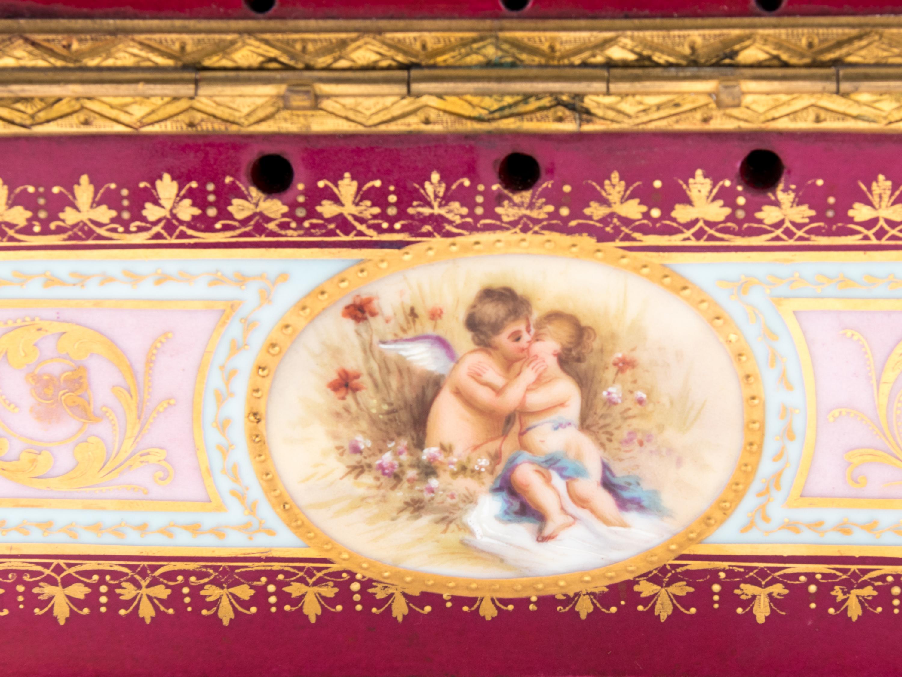 A Vienna Gilt Metal Mounted, Painted and Parcel Gilt Porcelain Table Casket