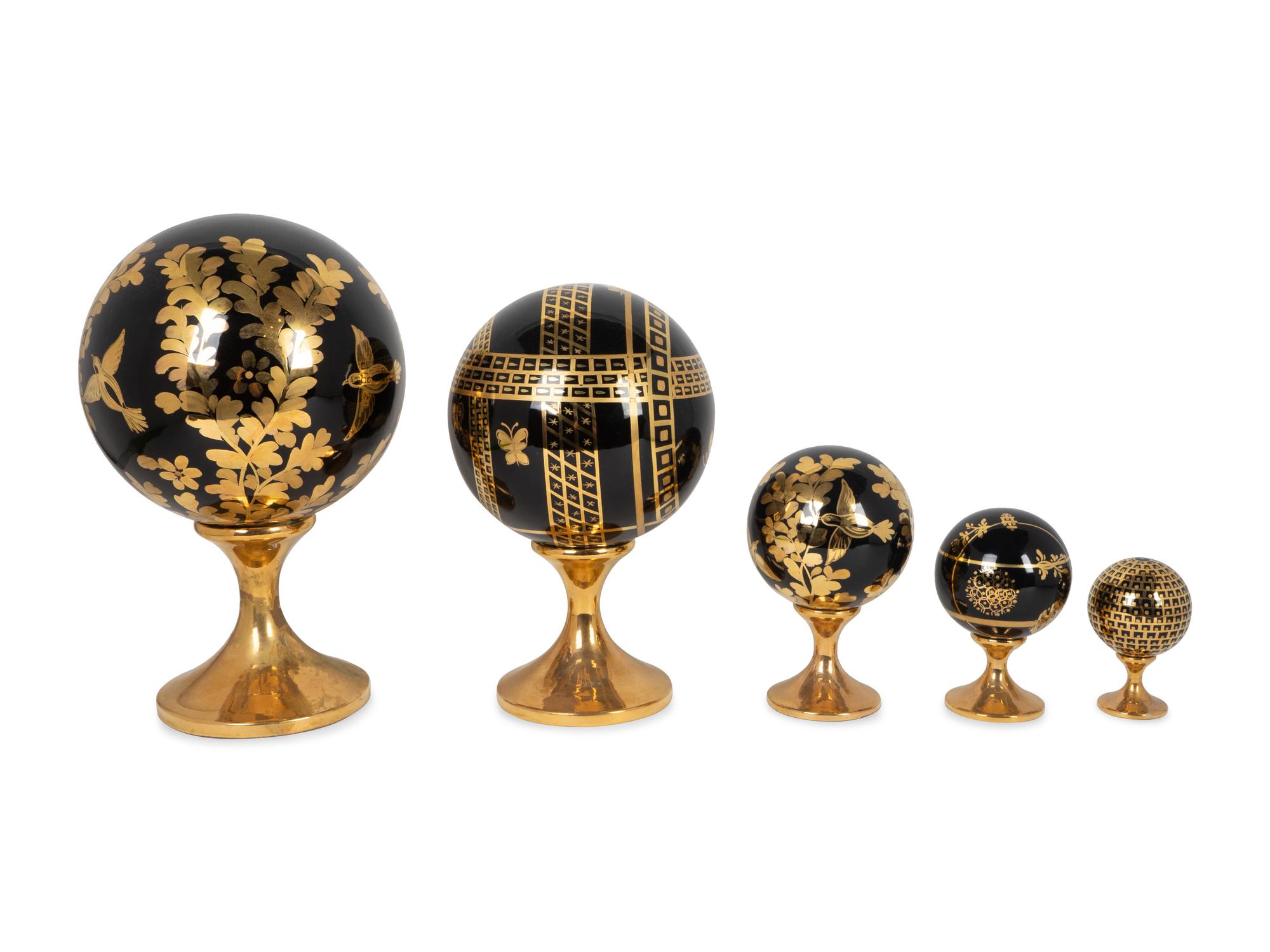 Five Italian Parcel-Gilt and Black-Glazed Porcelain Globes — MARKED PIU PIU ITALY, 20TH CENTURY