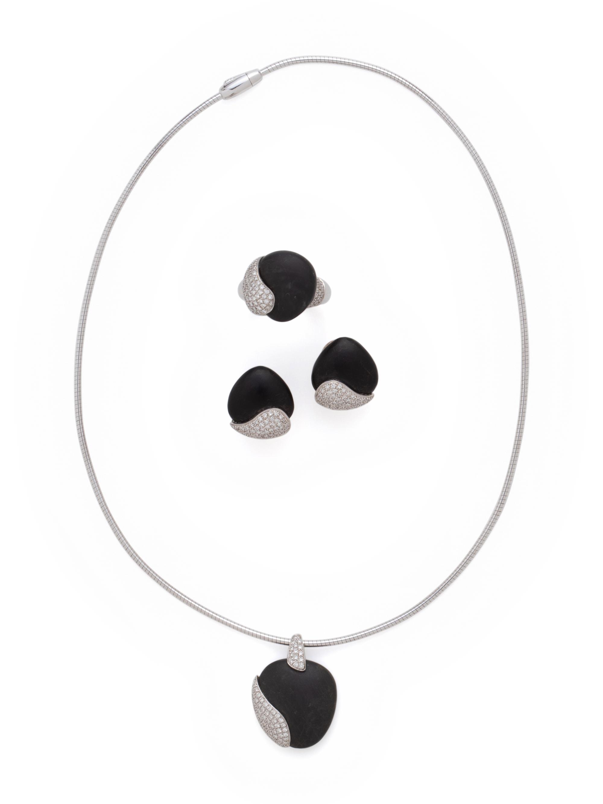 MOVADO, WHITE GOLD, PEBBLE AND DIAMOND SET