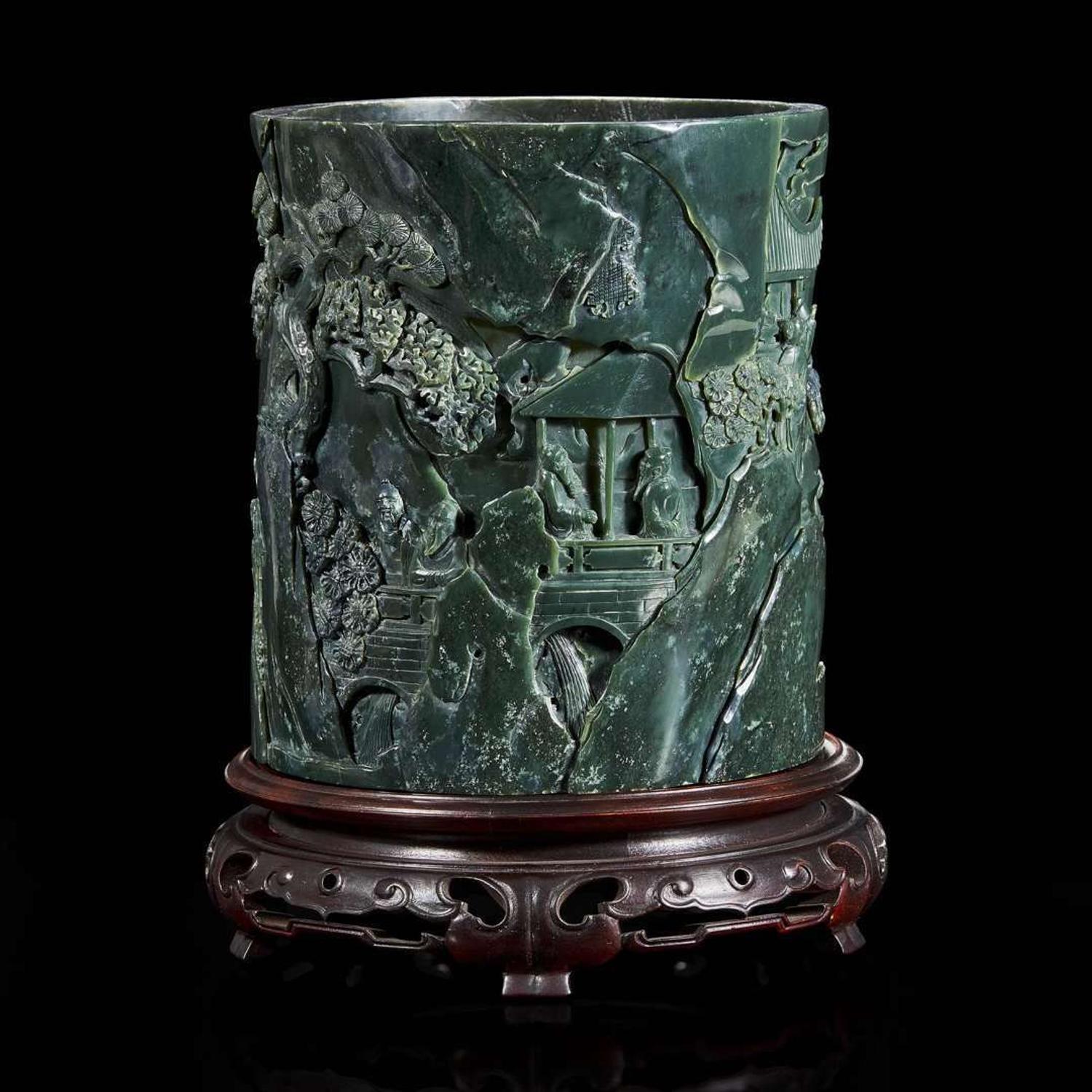 A Chinese carved dark green hardstone brushpot with marble-inlaid wood stand