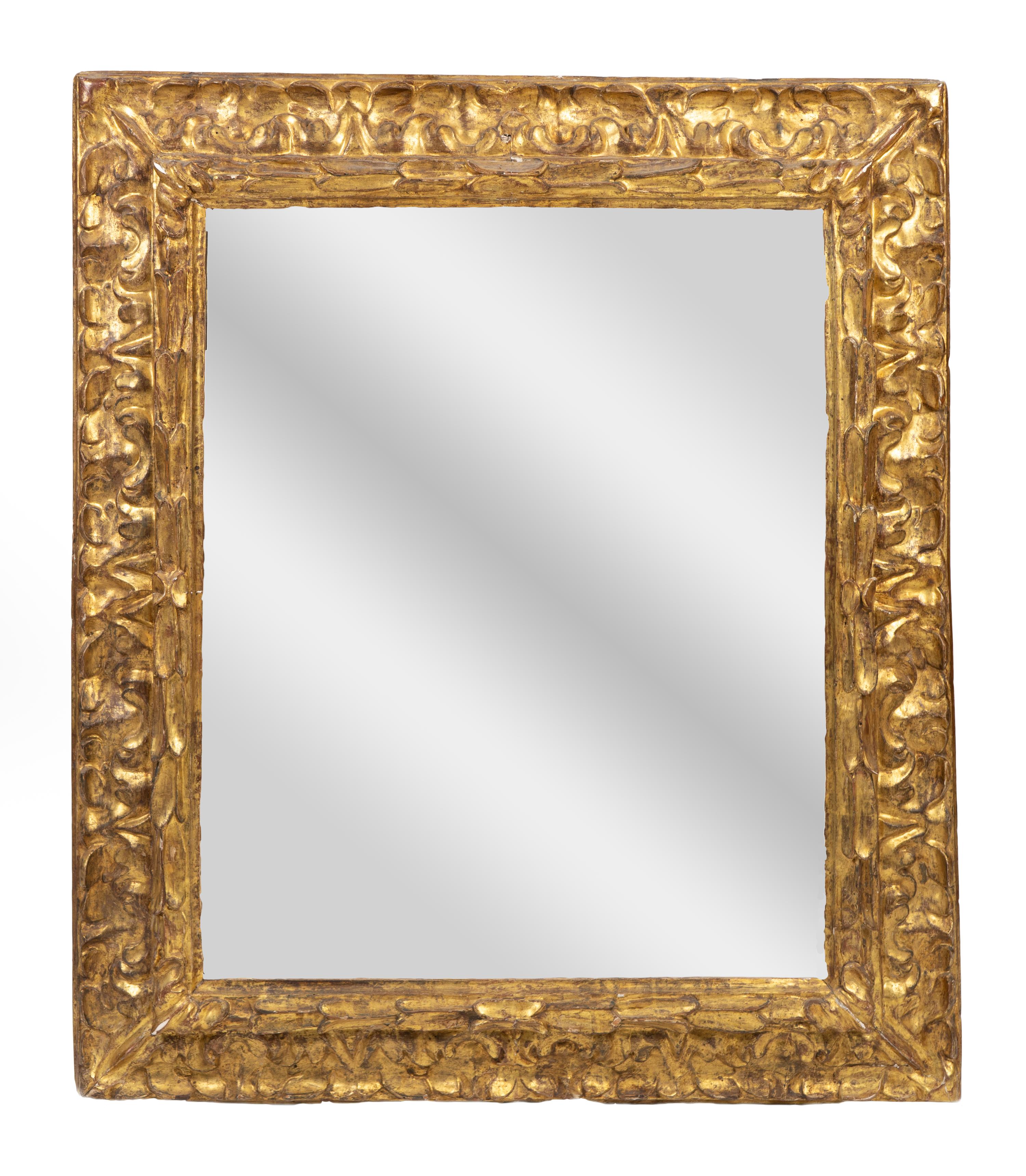 An Italian Baroque Giltwood Mirror