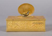 A Continental Gilt Bronze Singing Bird Box, probably German, Width 3 7/8 inches.