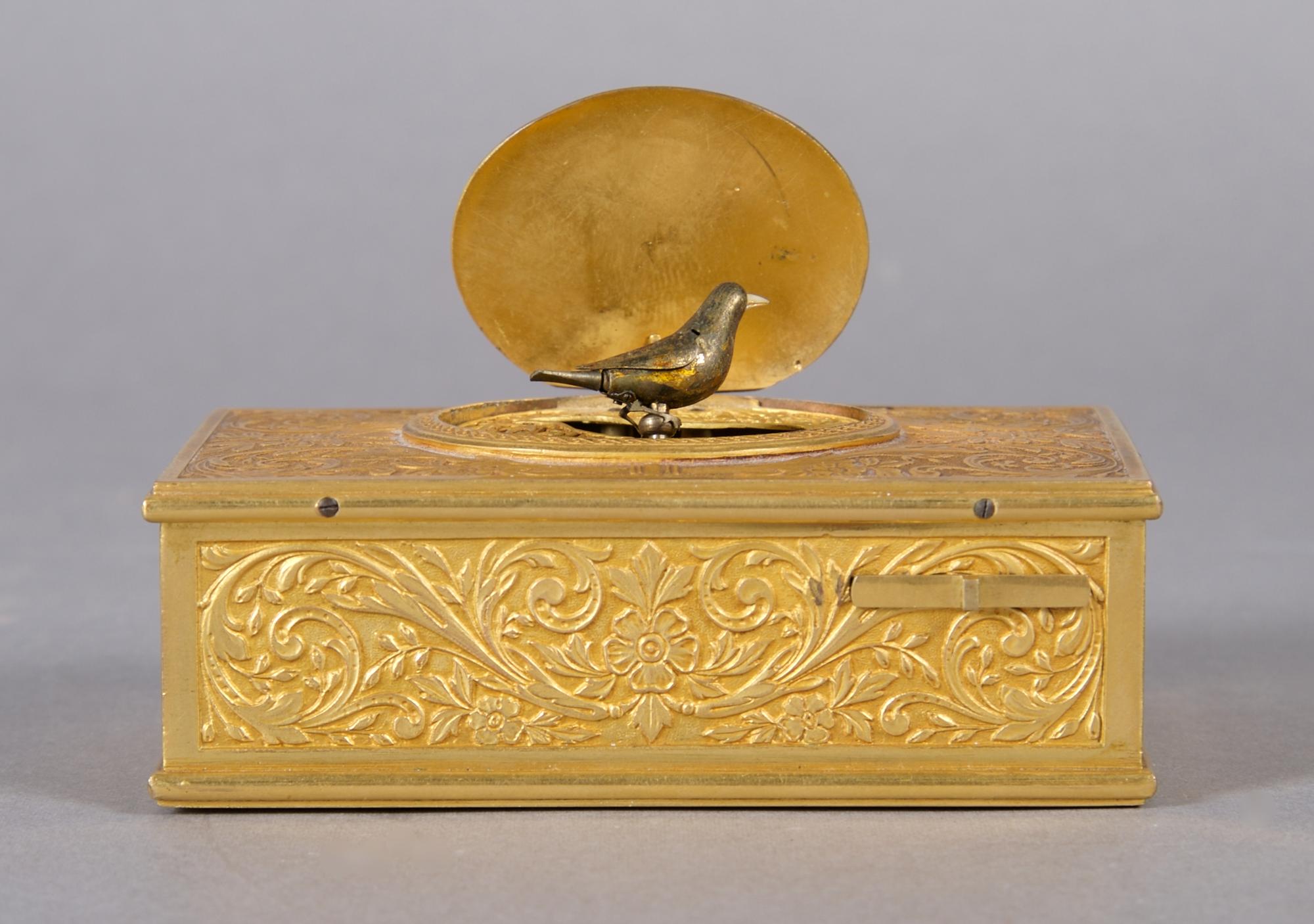 A Continental Gilt Bronze Singing Bird Box, probably German, Width 3 7/8 inches.