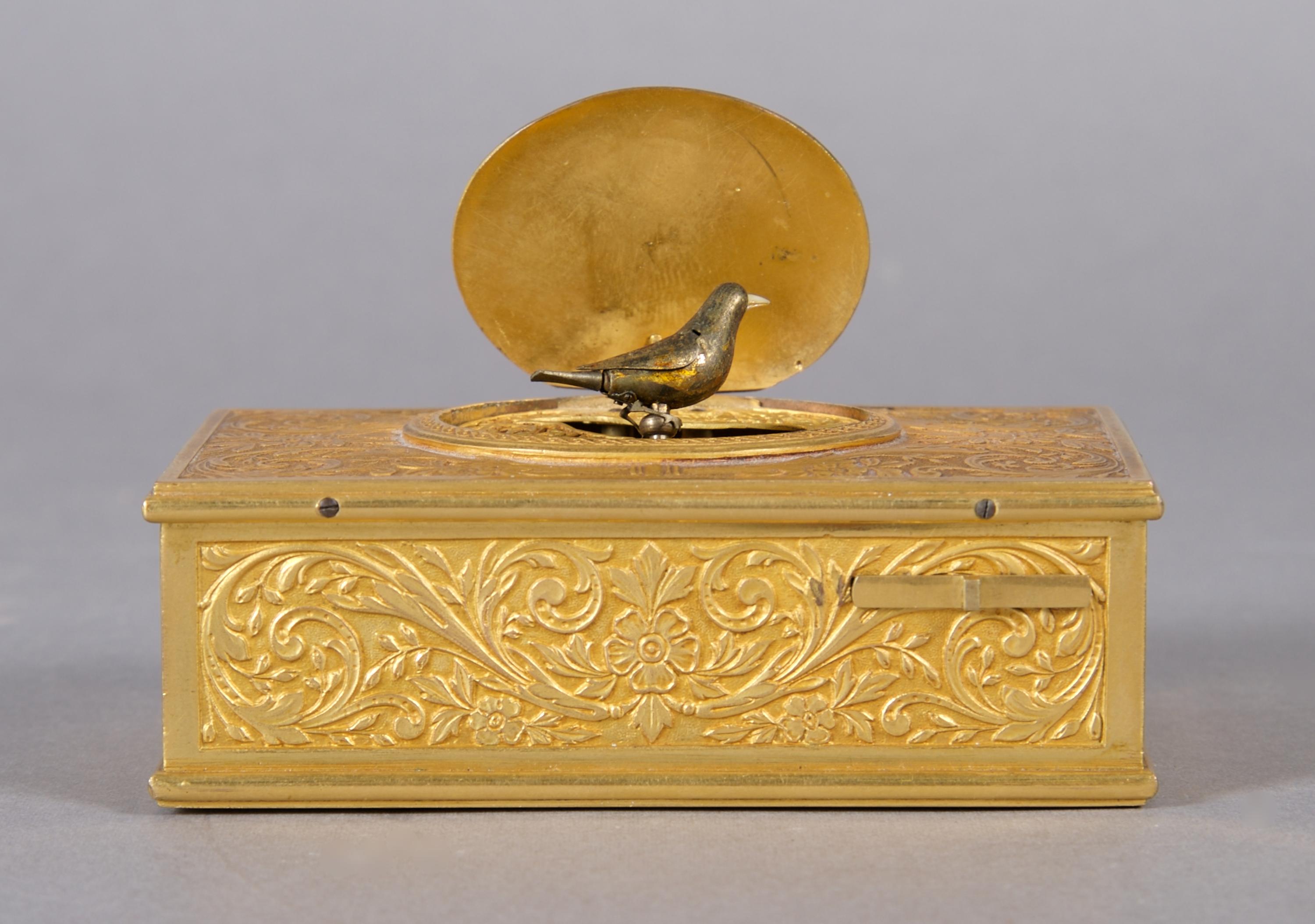 A Continental Gilt Bronze Singing Bird Box, probably German, Width 3 7/8 inches.