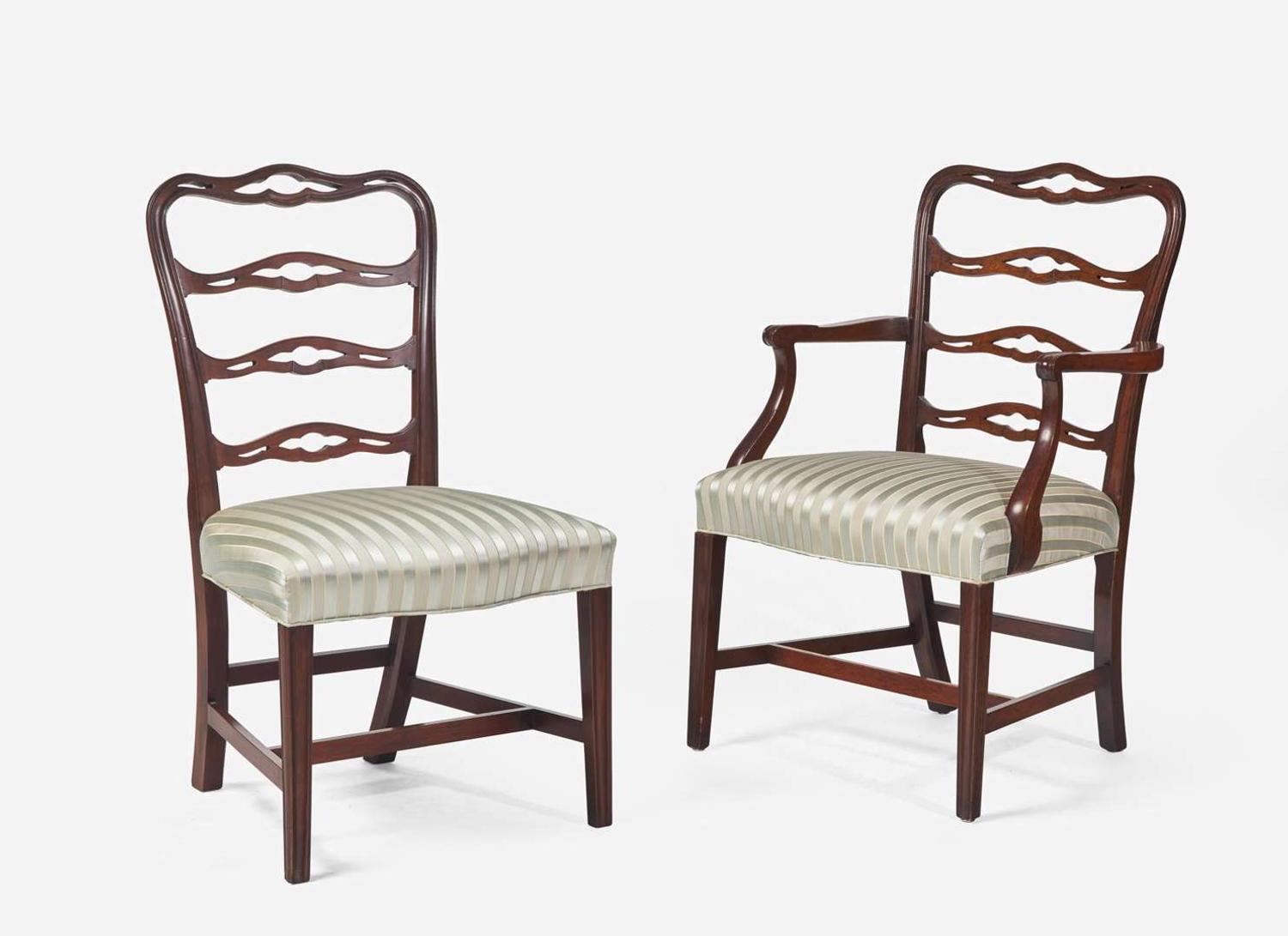 A set of eight Chippendale style mahogany ribbon-back dining chairs, 20th century