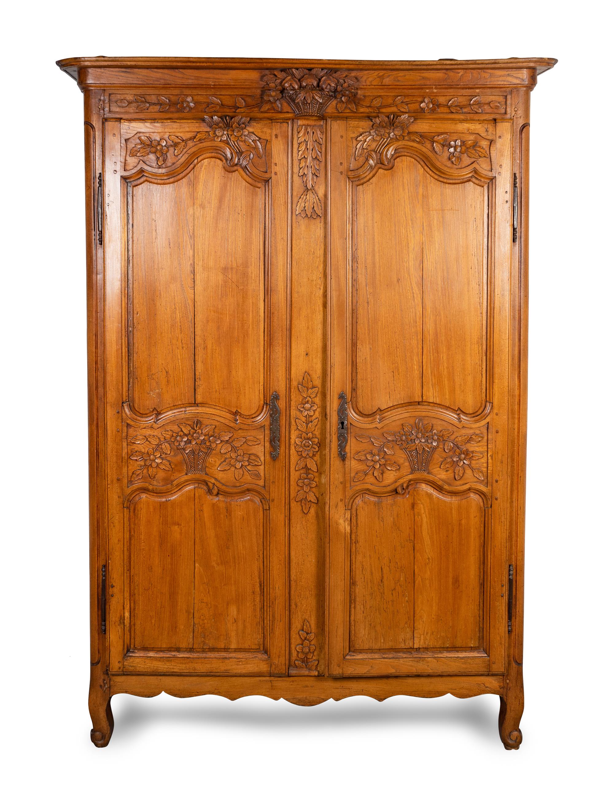 A Louis XV Provincial Carved Fruitwood Armoire — LATE 18TH/EARLY 19TH CENTURY