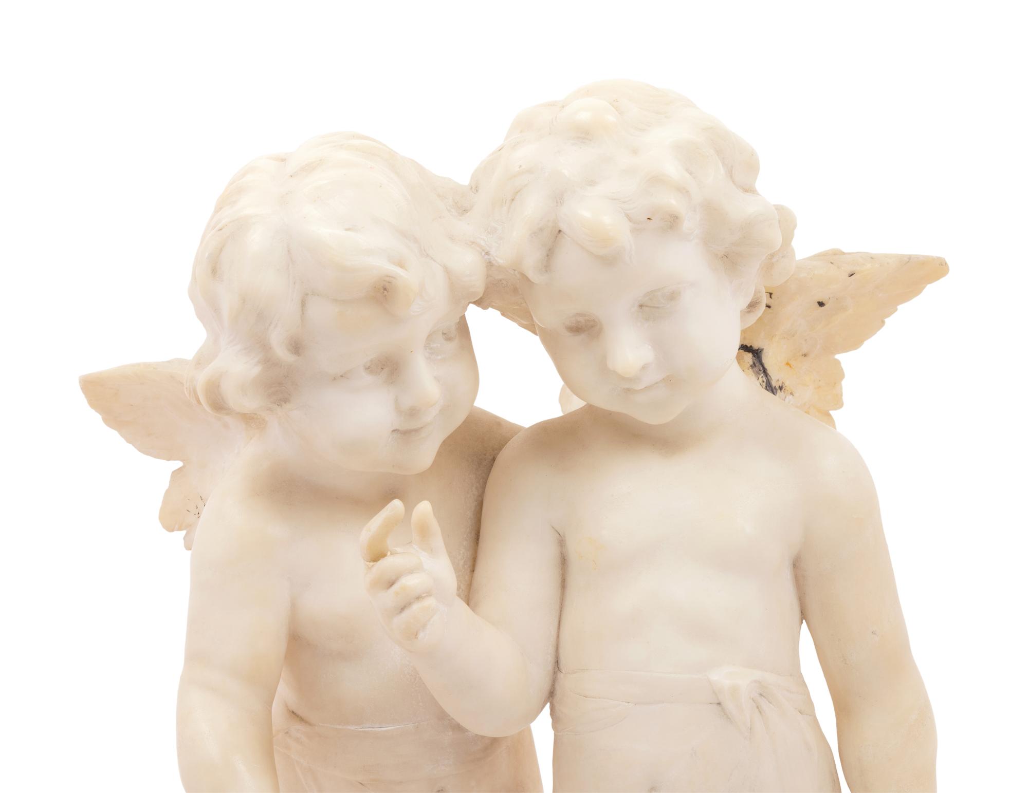 A Carved Marble Figure of Two Putti