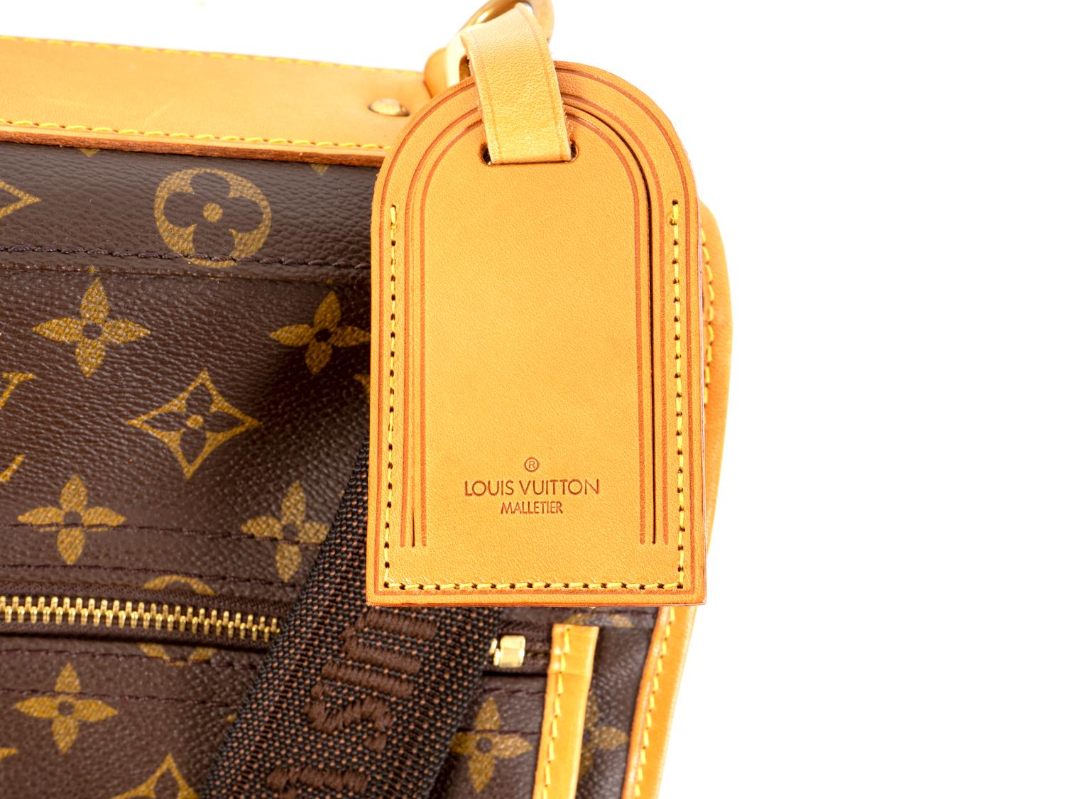 A Louis Vuitton Leather Garment Bag — 20TH CENTURY