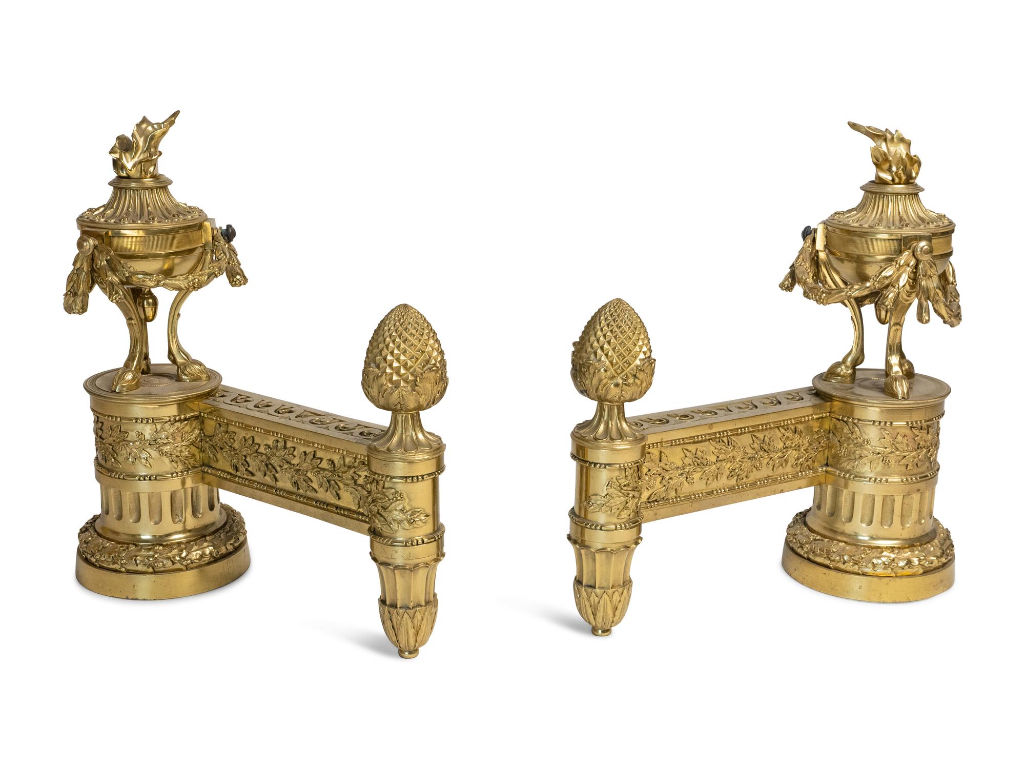 A Pair of Louis XVI Style Gilt Bronze Chenets with Flaming Urn Finials — 20TH CENTURY