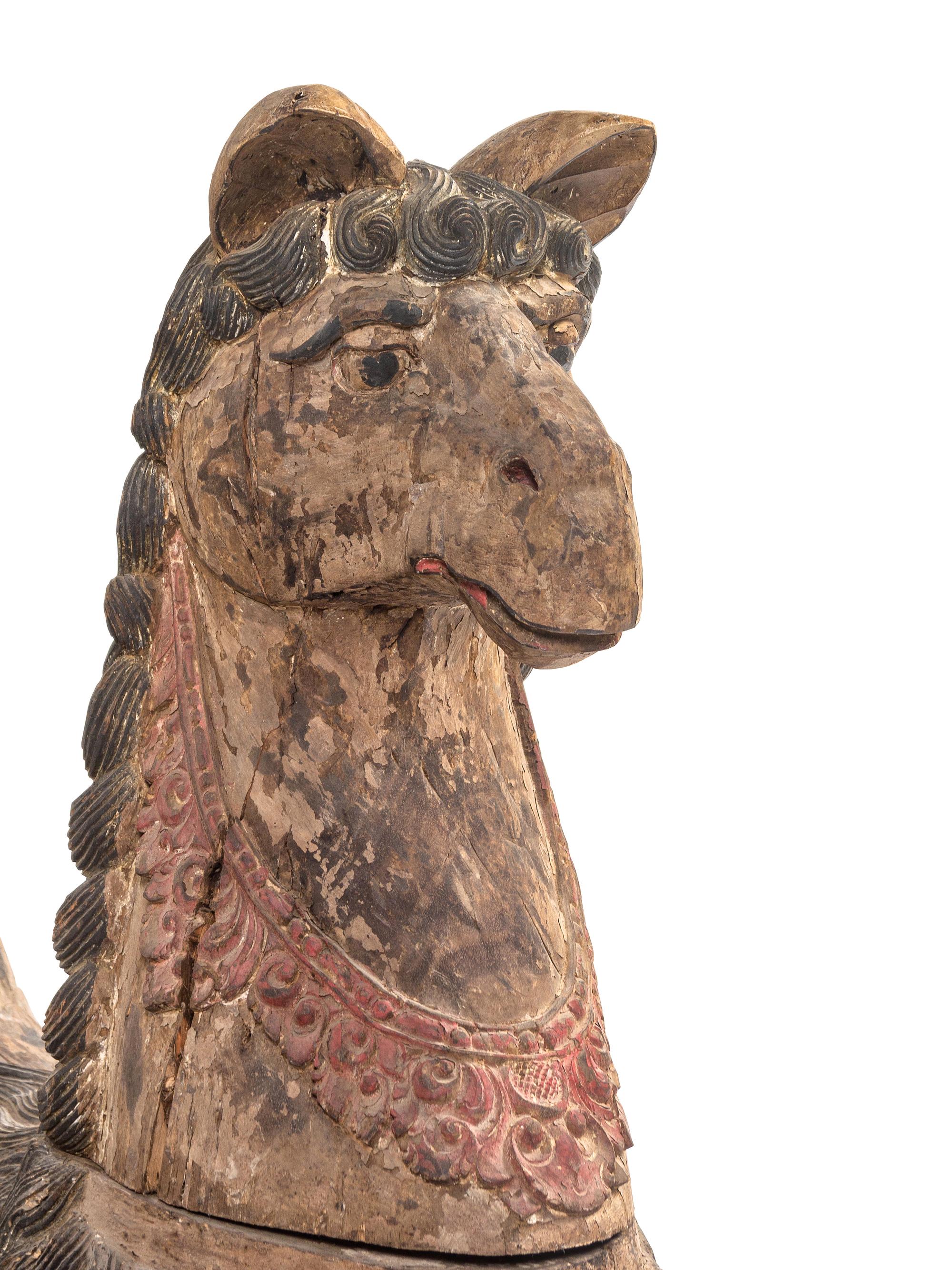 A Pair of Large Balinese Carved and Polychrome Decorated Models of Hippocampi