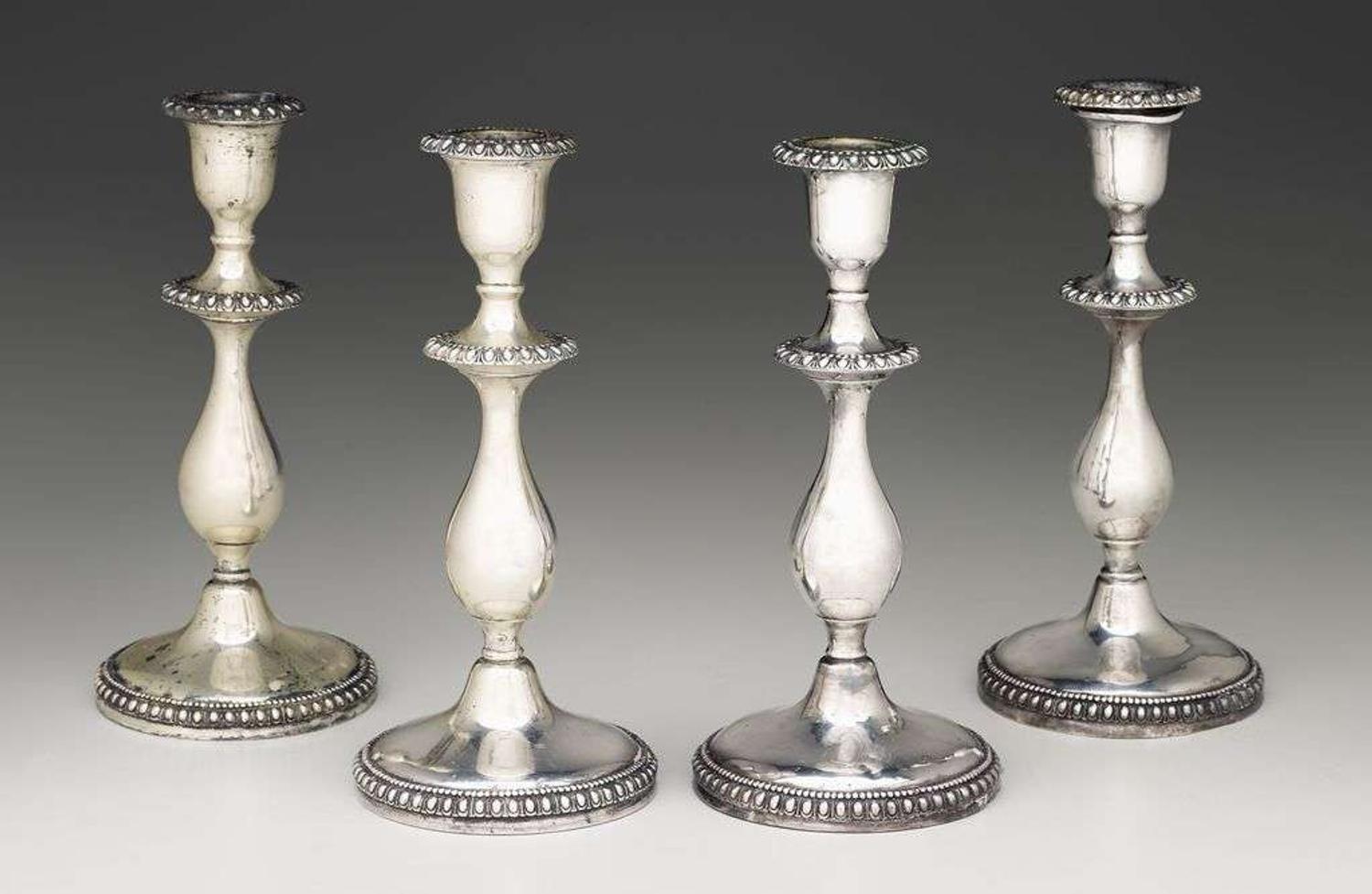 Four sterling silver candlesticks j.e. caldwell & co., philadelphia, pa, late 19th/early 20th century