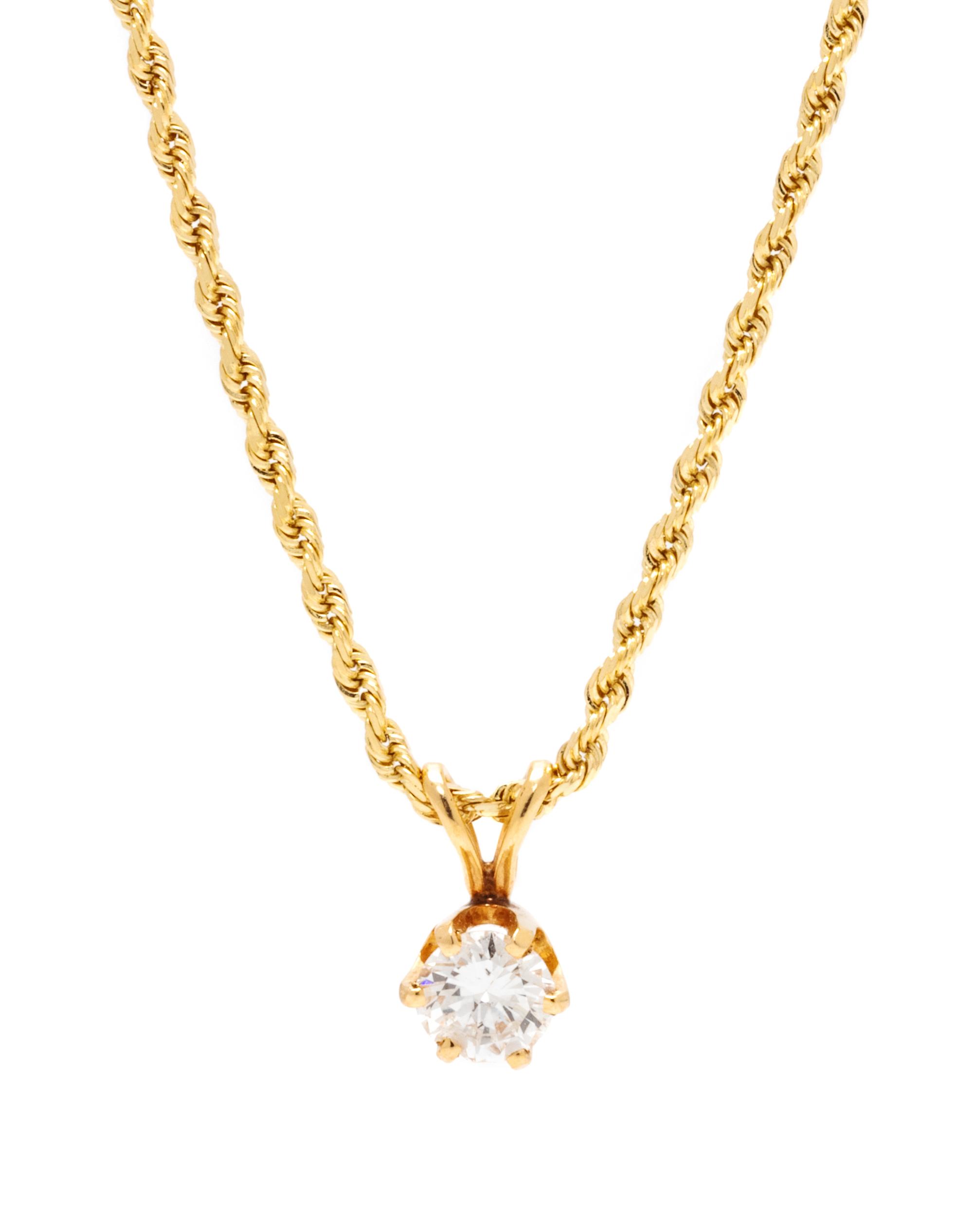 A 14 Karat Yellow Gold and Diamond Pendant/Necklace,