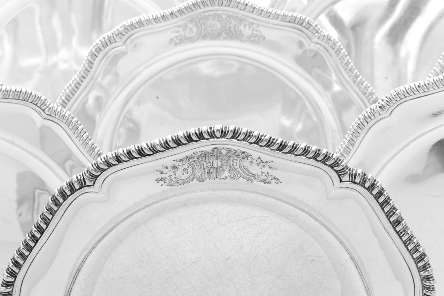 A Set of Twelve Irish George III Silver Dinner Plates, Robert Calderwood, Dublin, Circa 1762, each having an undulating gadrooned rim a