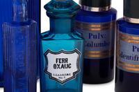 A Group of Blue Glass Apothecary Bottles