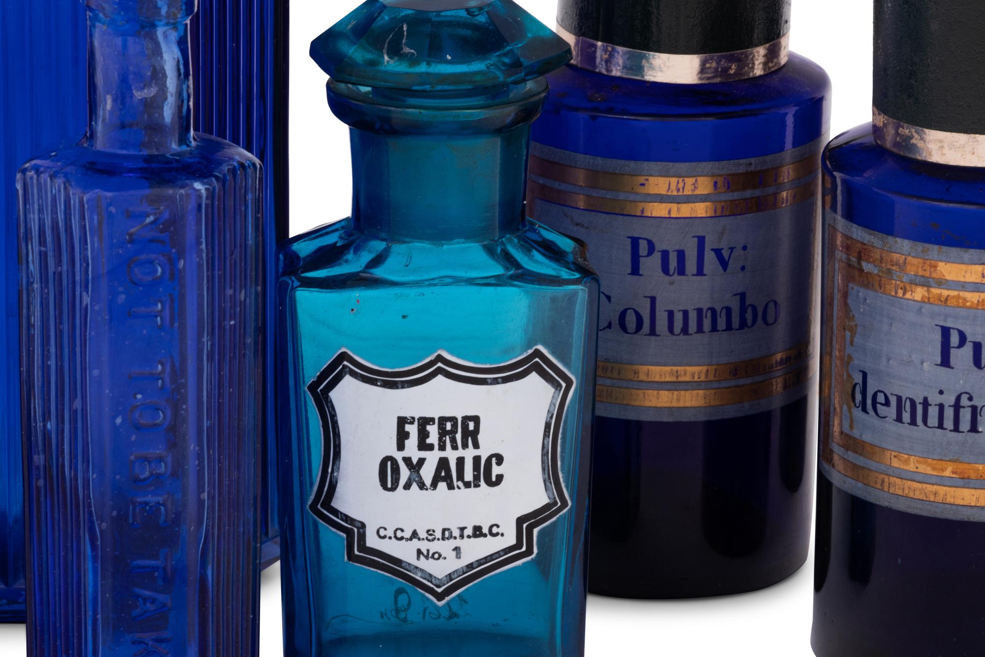 A Group of Blue Glass Apothecary Bottles