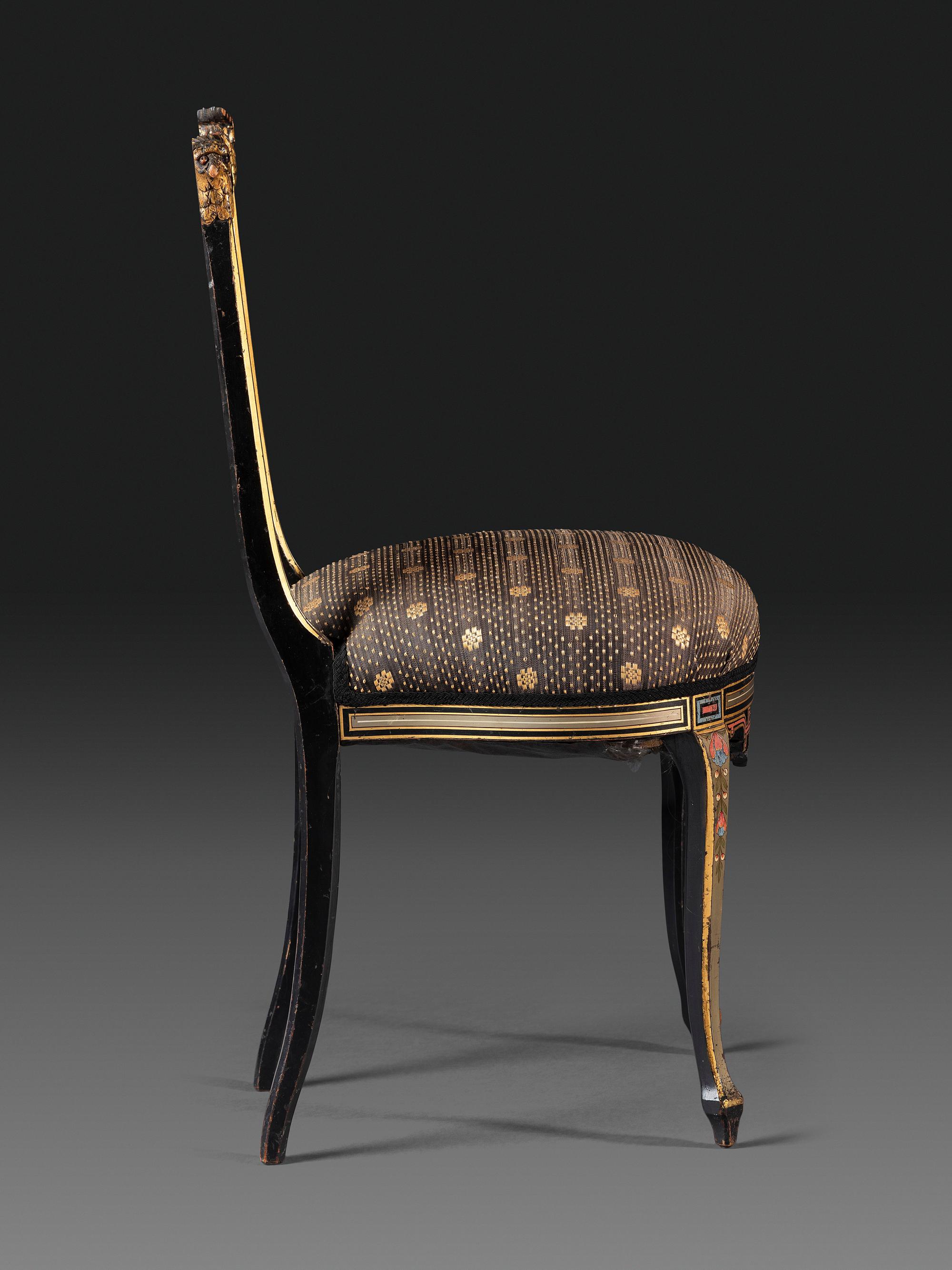 An Aesthetic Movement Painted, Parcel Gilt and Ebonized Bird-Carved Side Chair