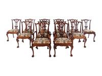 A Set of Twelve George II Style Carved Mahogany Dining Chairs