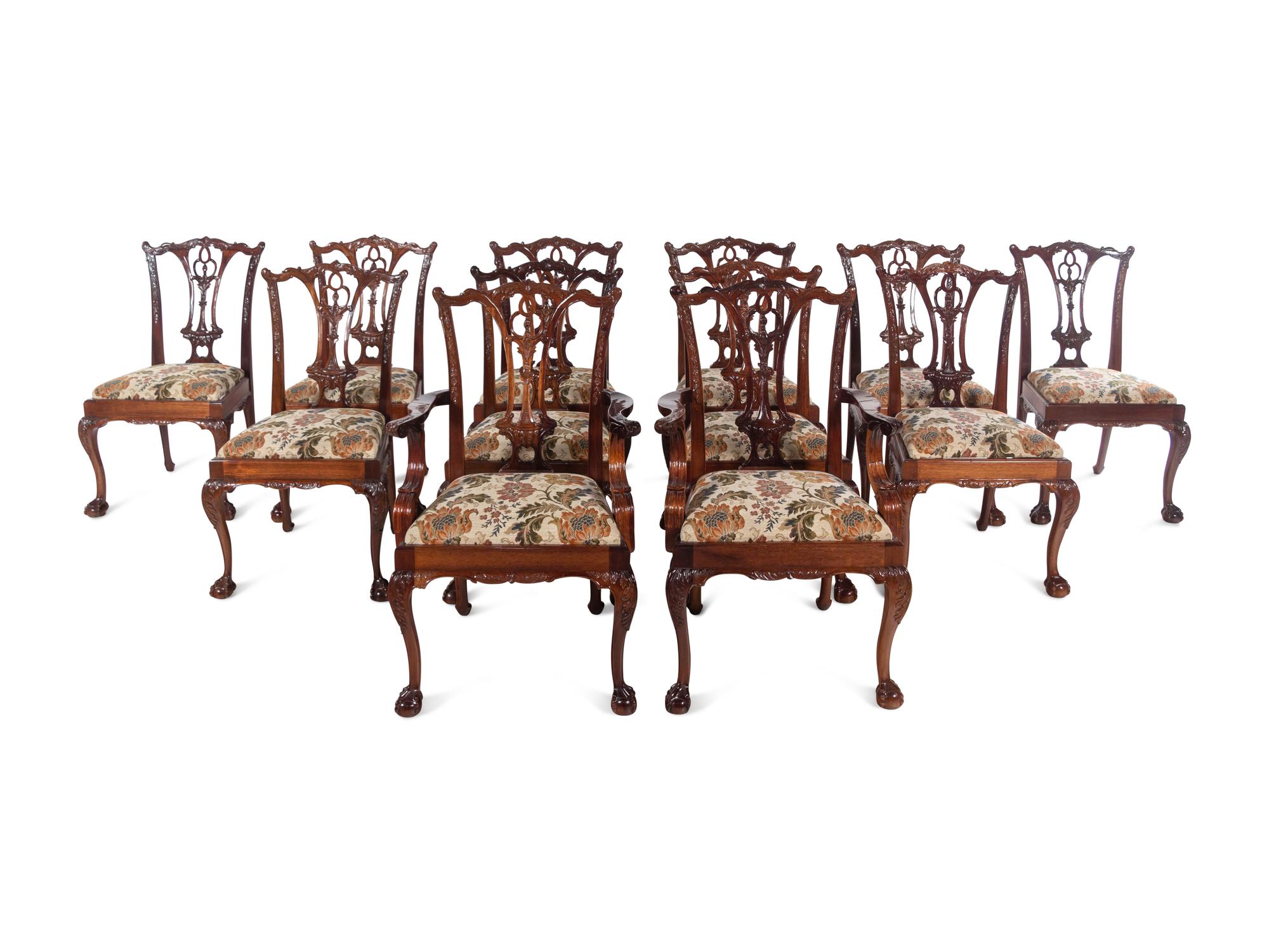 A Set of Twelve George II Style Carved Mahogany Dining Chairs