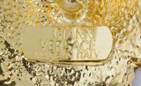 A Pair of Gianni Versace Medusa and Rhinestone Fringe Earclips, Medallion: 1.75" diameter; Drop: 3.5".