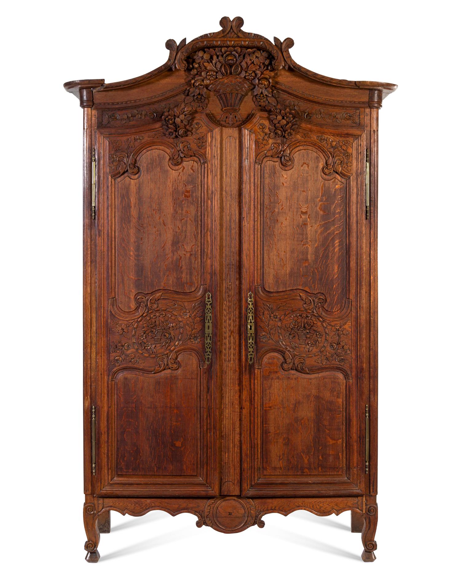 A French Provincial Carved Oak Armoire