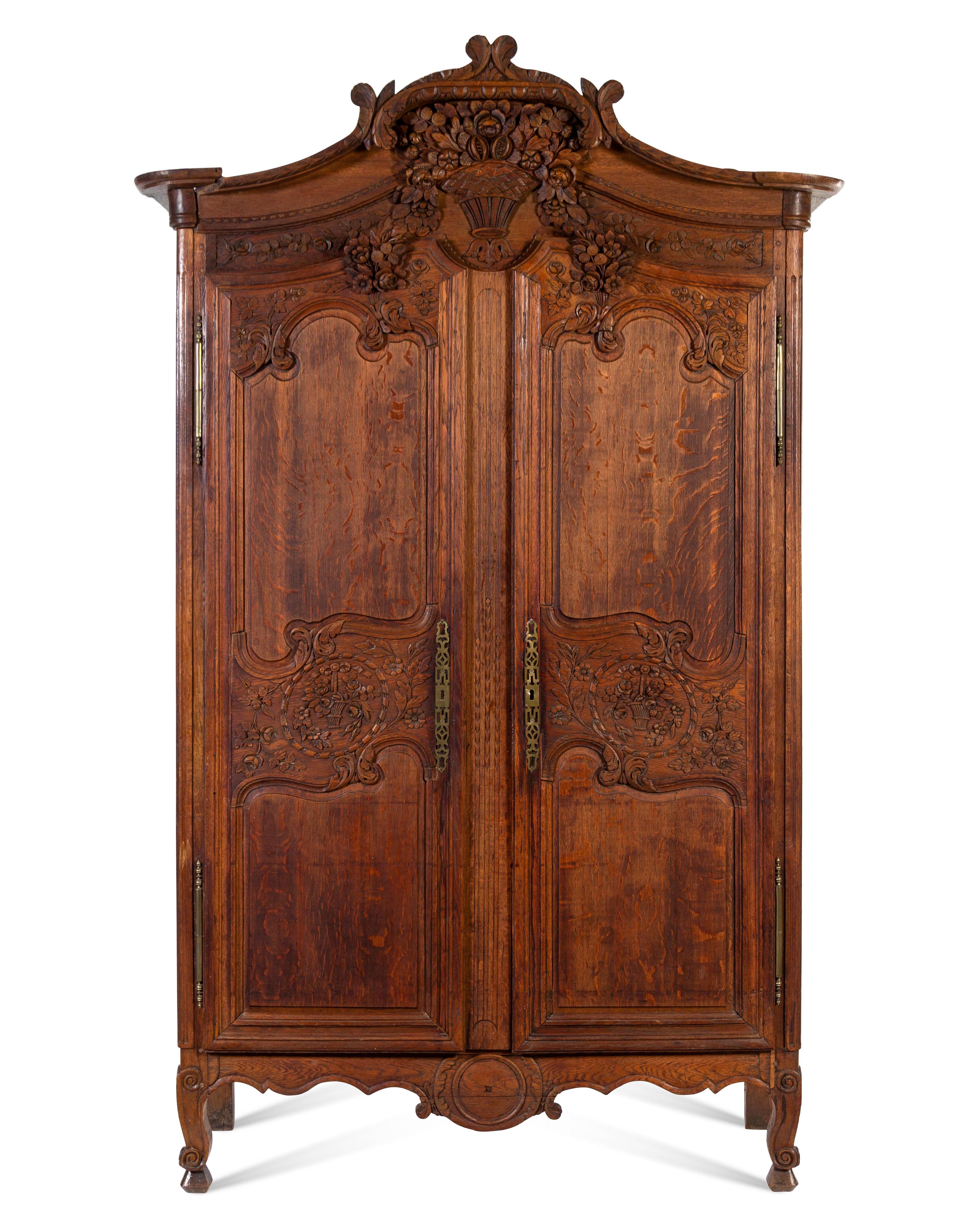 A French Provincial Carved Oak Armoire