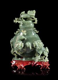 A Spinach Jade 'Fu Lion' Vase and Cover Height 8 inches. — EARLY 20TH CENTURY