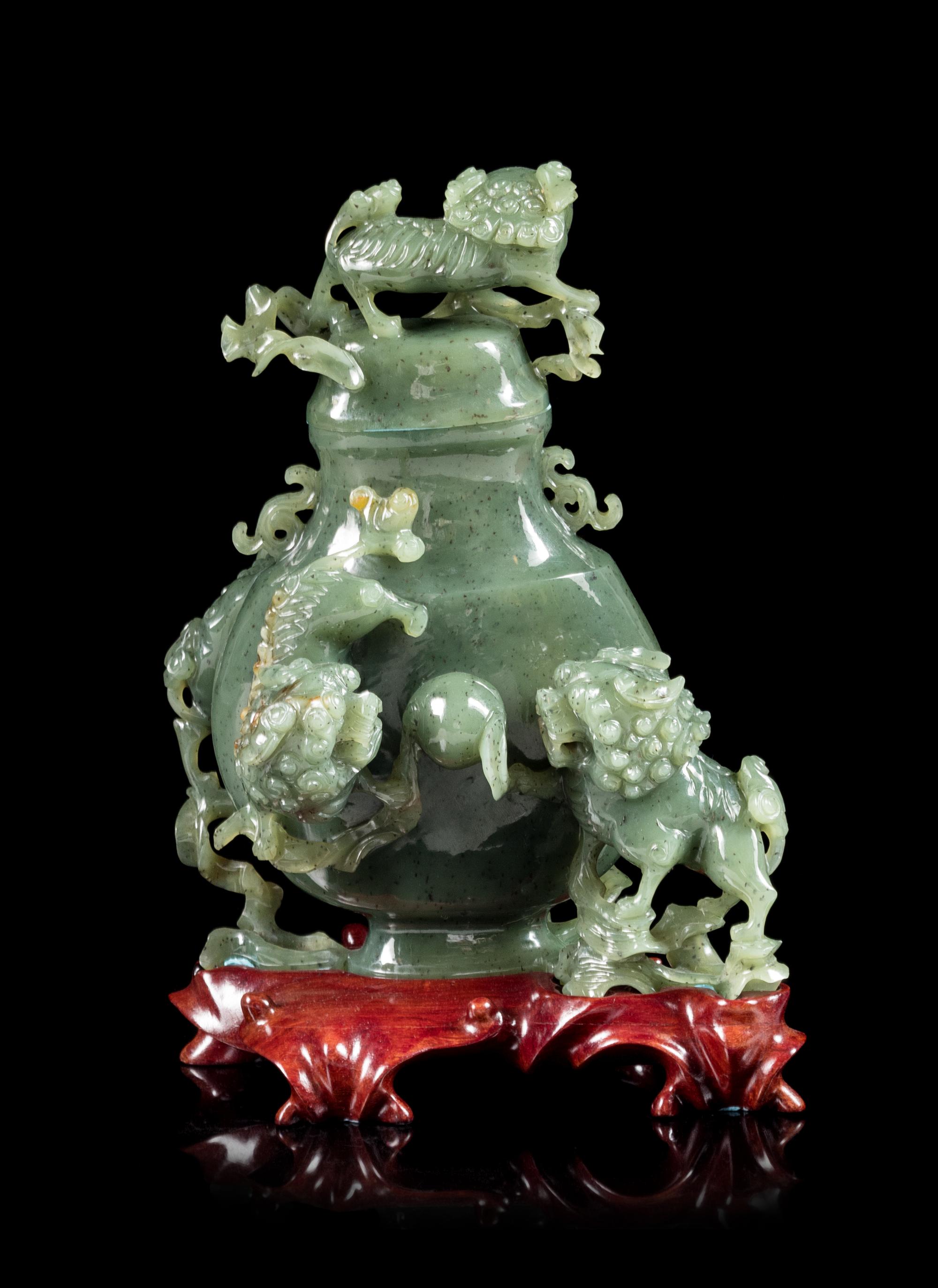 A Spinach Jade 'Fu Lion' Vase and Cover Height 8 inches. — EARLY 20TH CENTURY