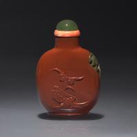A Chinese Carved Jasper Snuff Bottle, Qing Dynasty, 19th Century — 清中期 羊肝瑪瑙雕獅子圖鼻煙壺