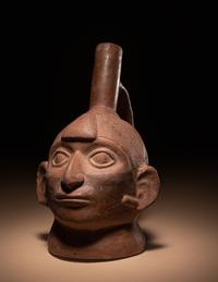 A Moche Warrior Face Stirrup Vessel