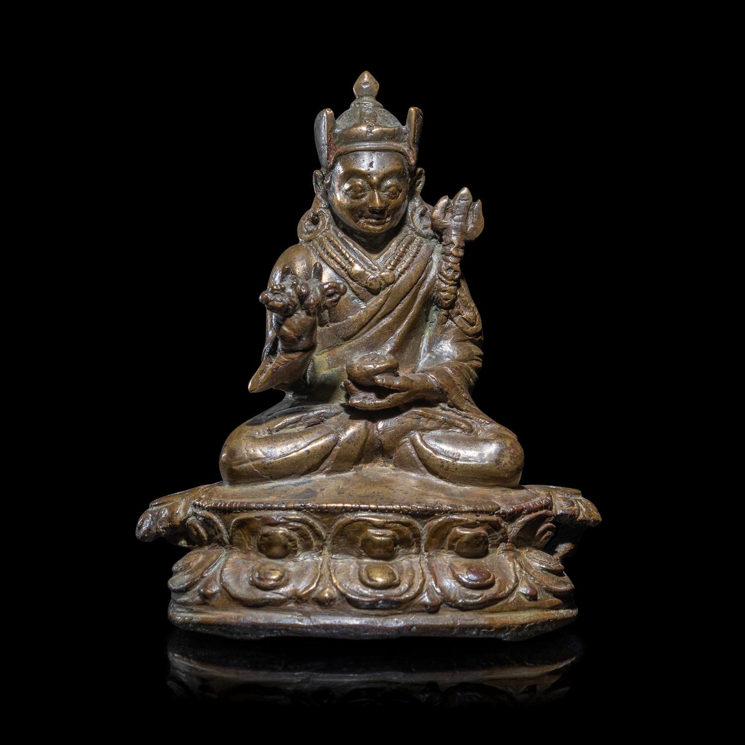 A Tibetan Copper Alloy Seated Figure of Padmasambhava, 16th/17th Century 十六/十七世紀 西藏銅合金銅蓮花生坐像