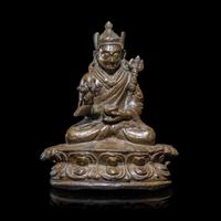 A Tibetan Copper Alloy Seated Figure of Padmasambhava, 16th/17th Century 十六/十七世紀 西藏銅合金銅蓮花生坐像