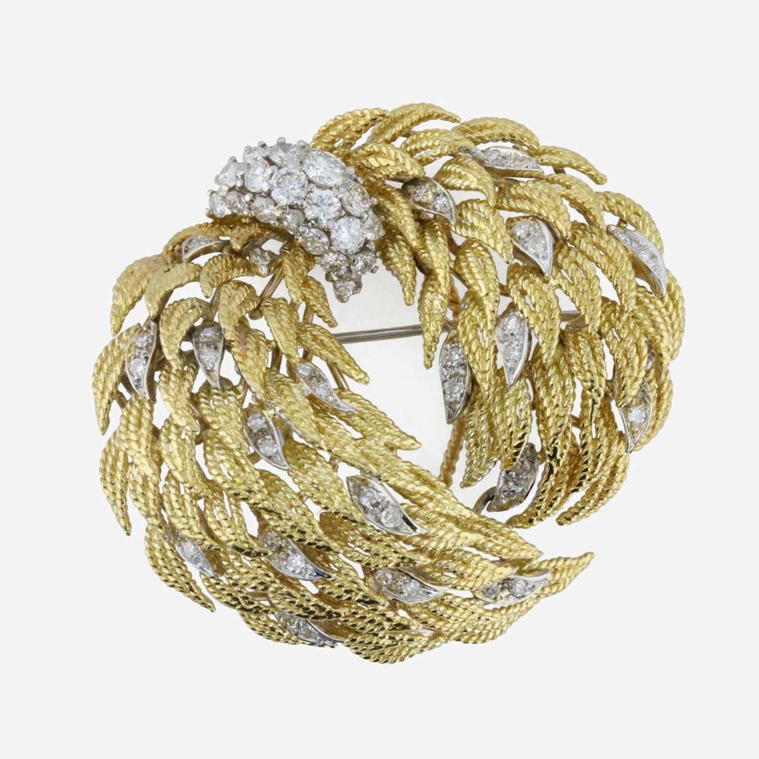 An 18K, bicolor diamond brooch