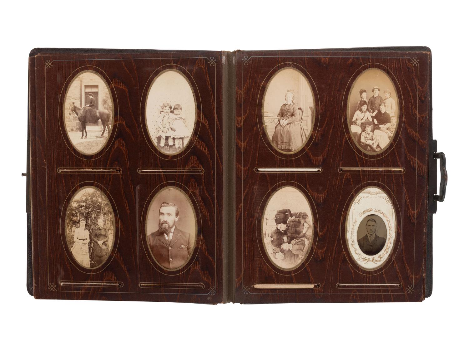 [EARLY PHOTOGRAPHY]. Four albums containing CDVs, tintypes, and cabinet cards of varying subjects.