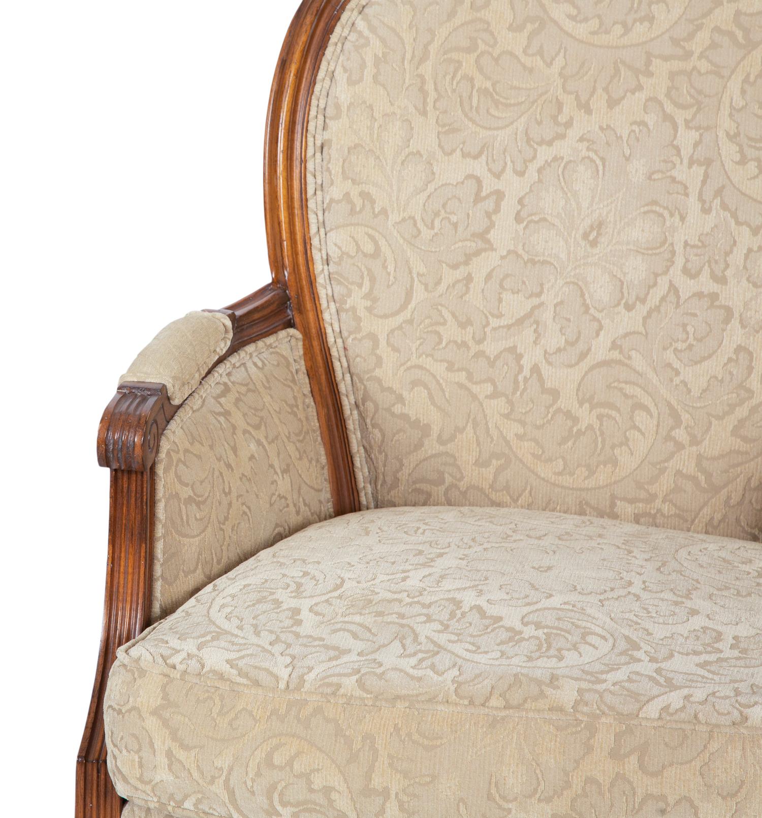 A Pair of Louis XVI Style Carved Walnut Bergères