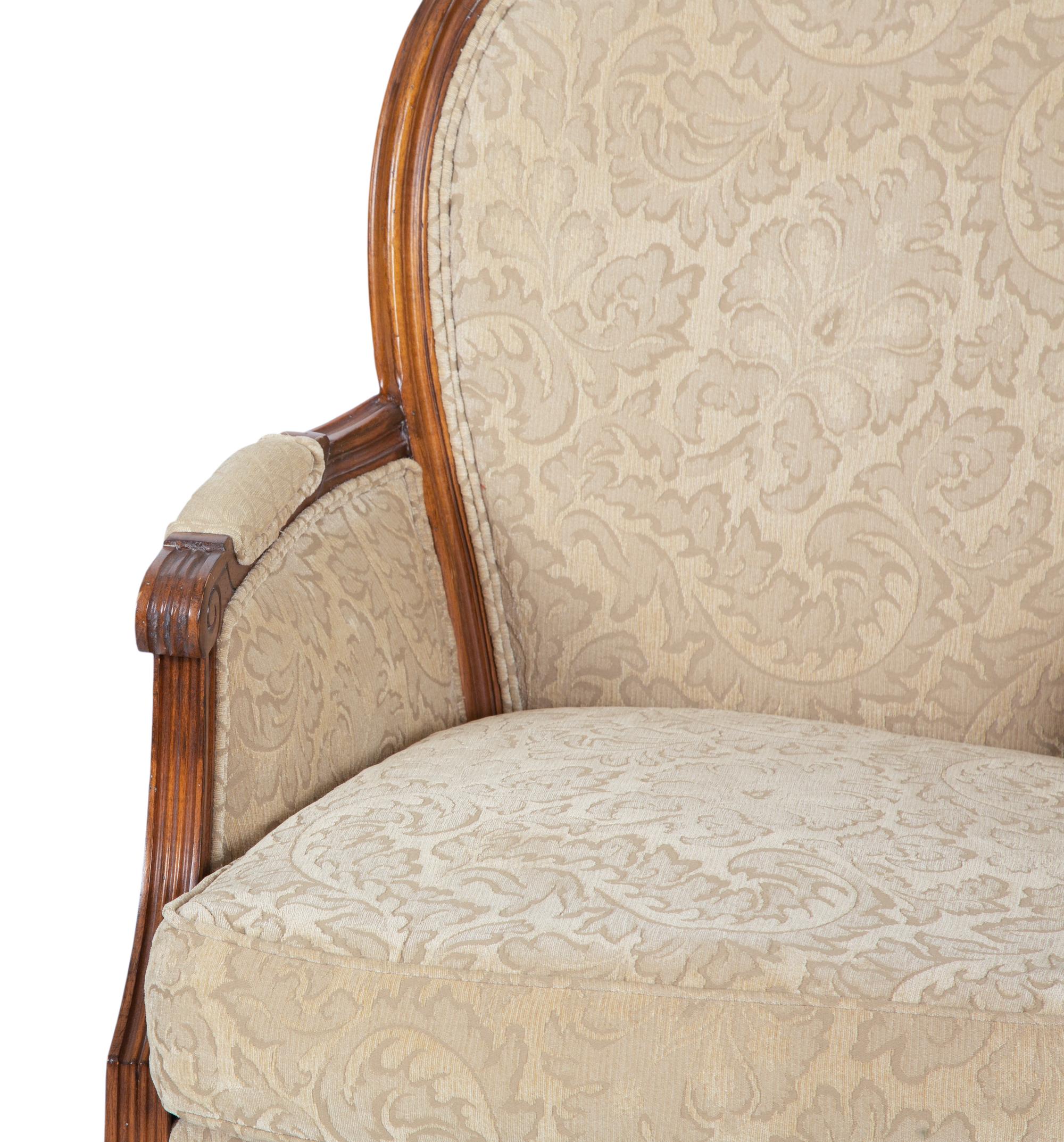 A Pair of Louis XVI Style Carved Walnut Bergères