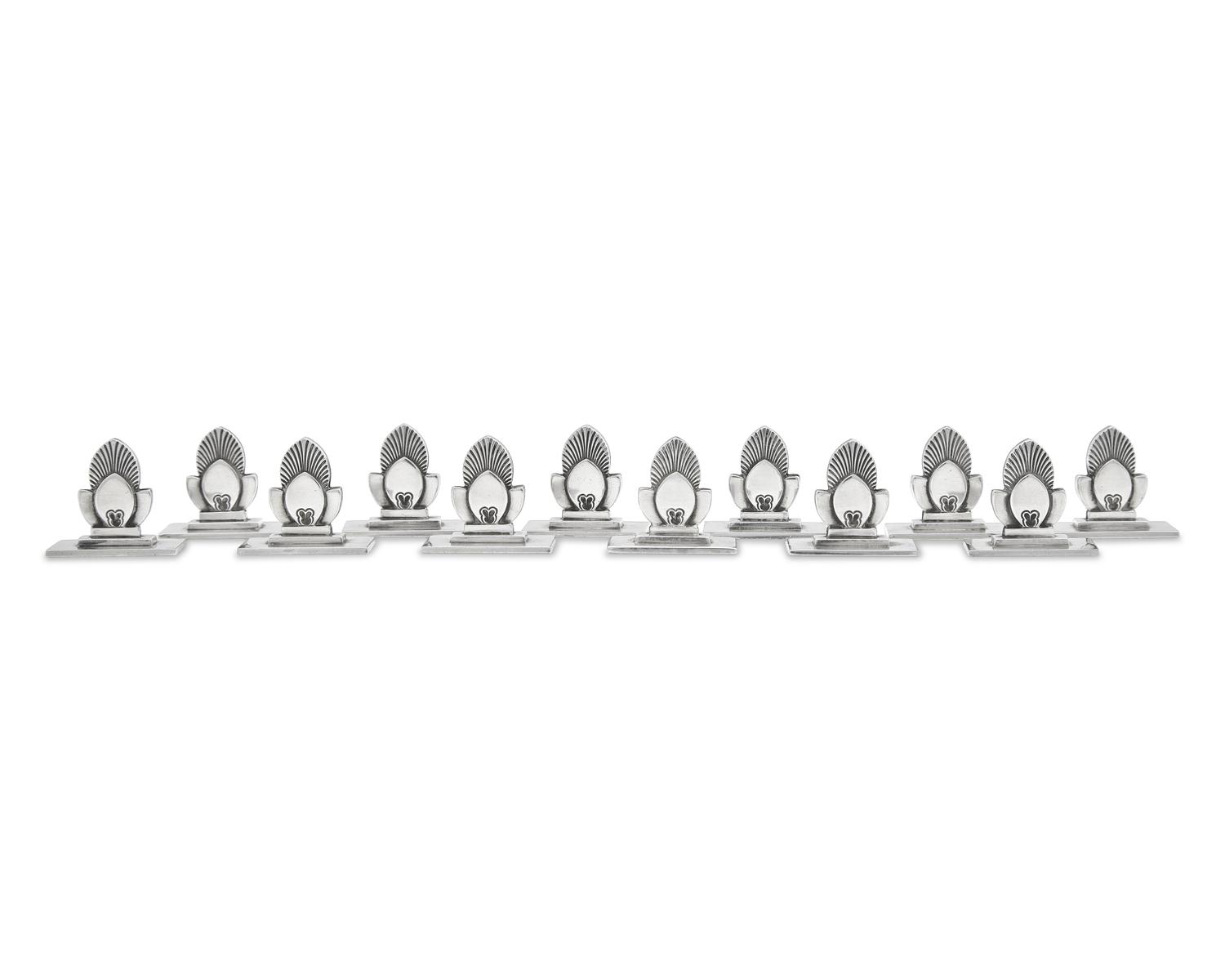 A Set of Twelve Gundorph Albertus Georg Jensen Silver Cactus Pattern Place Card Holders