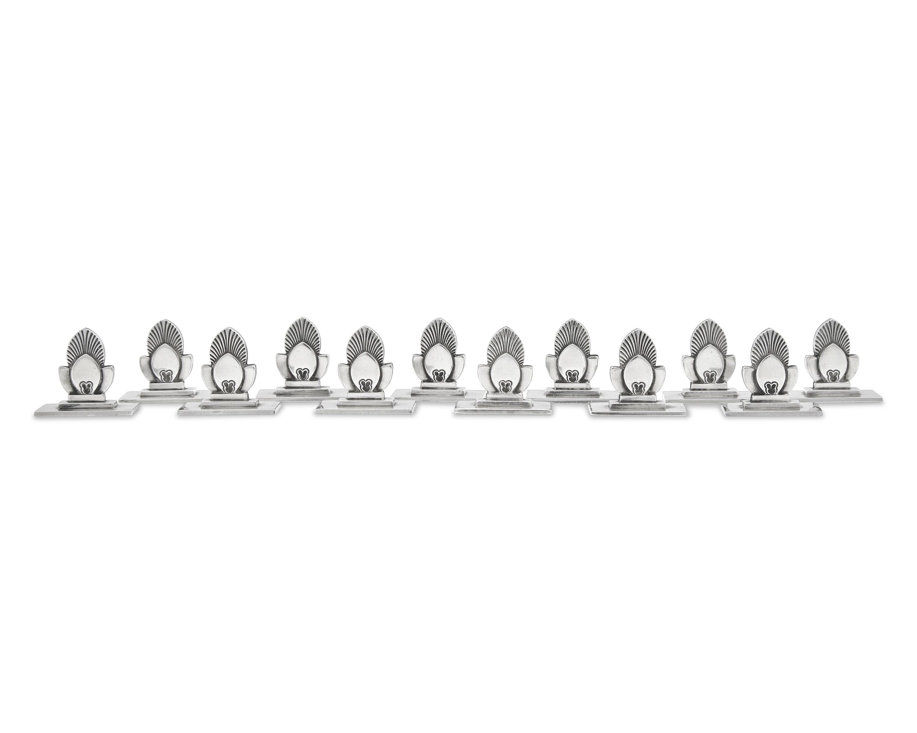 A Set of Twelve Gundorph Albertus Georg Jensen Silver Cactus Pattern Place Card Holders