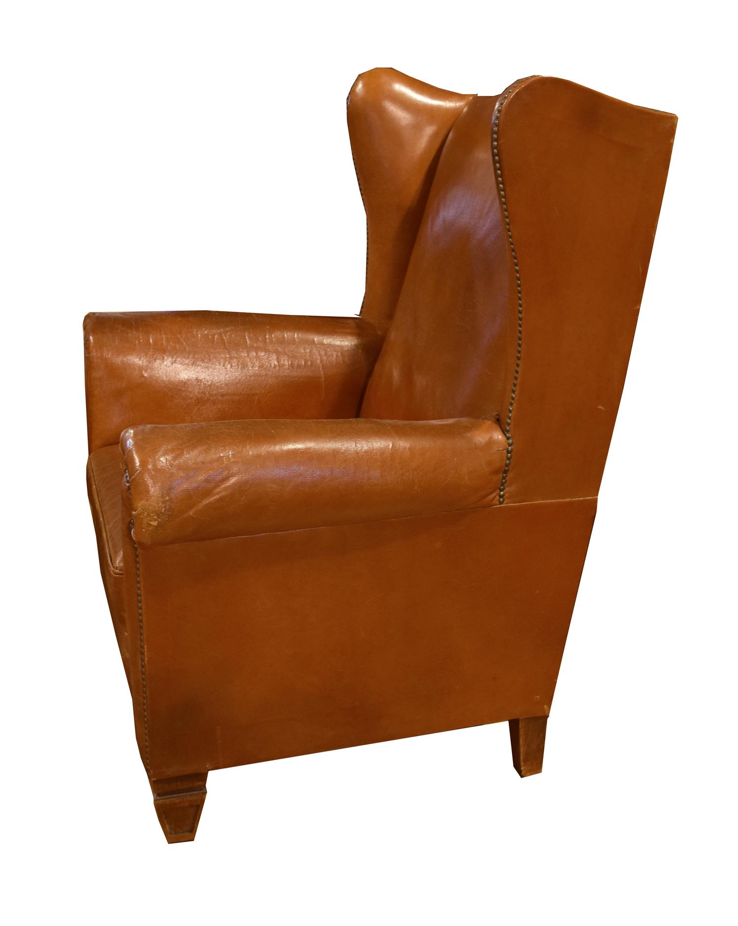 A Leather Upholstered Wingback Chair 34.5" W x 30" D x 41" H — Italy, Circa 1910