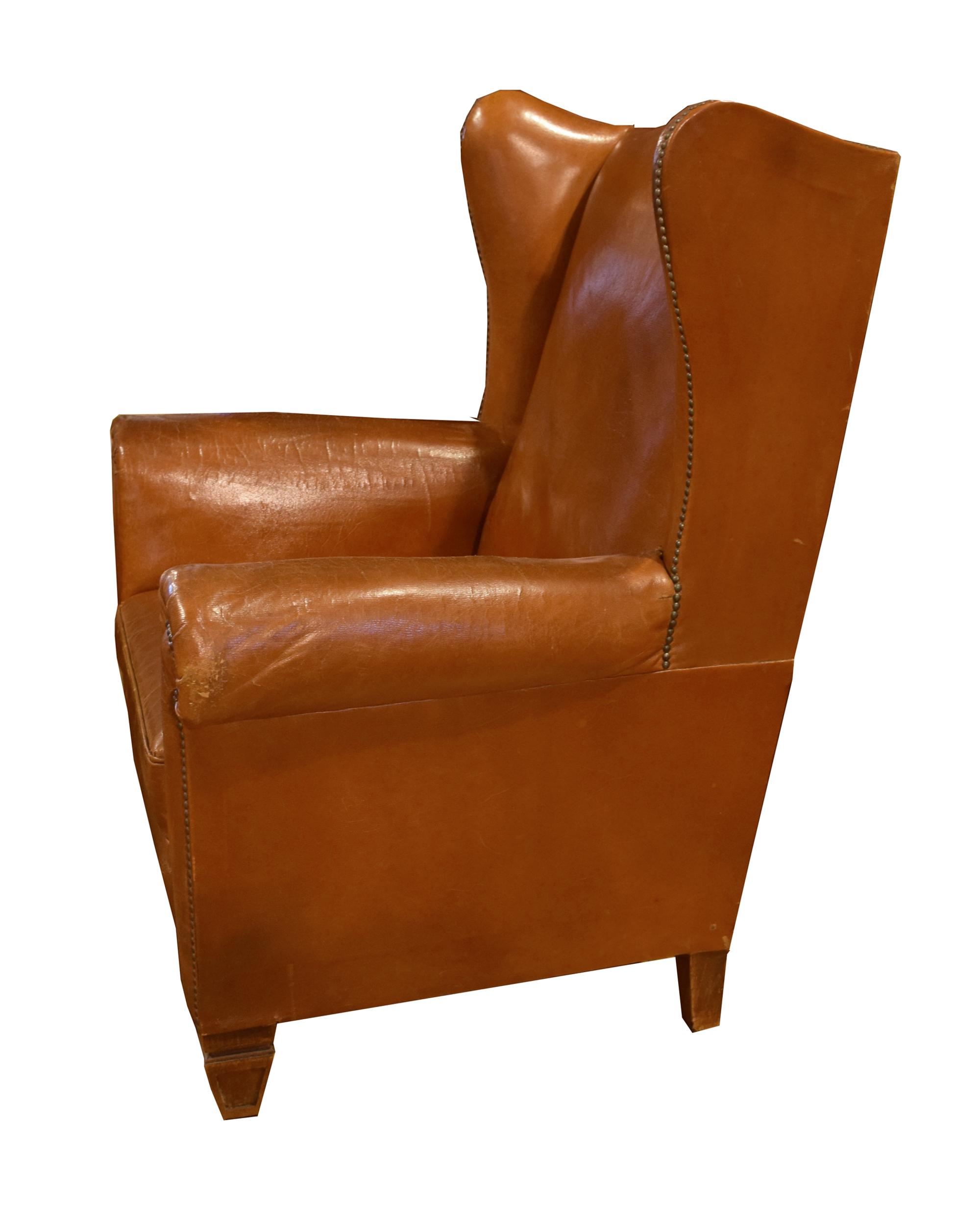 A Leather Upholstered Wingback Chair 34.5" W x 30" D x 41" H — Italy, Circa 1910