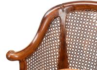A Pair of English Walnut Barrel-Back Armchairs