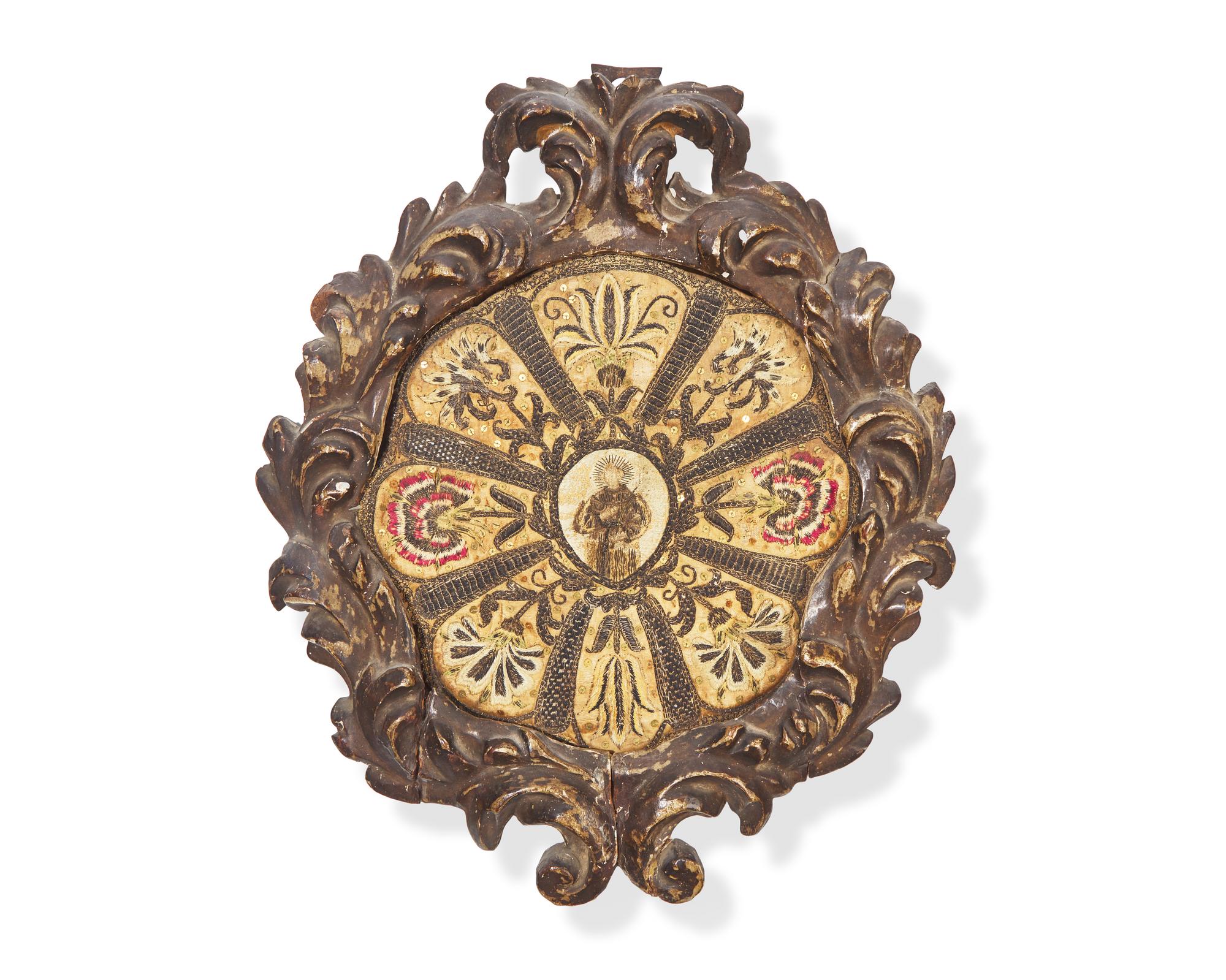 An Italian ecclesiastical embroidered silk roundel depicting a Saint, 18th century