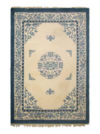 An Indian Blue and Ivory Chinese Style Wool Rug