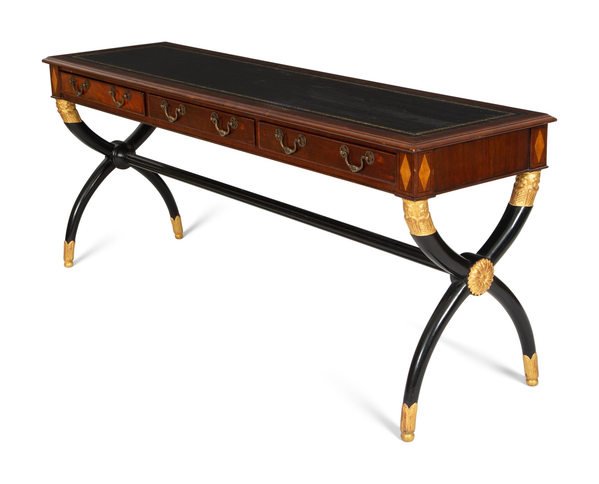 A Regency Style Parcel Gilt and Ebonized Mahogany Leather Top Console Table