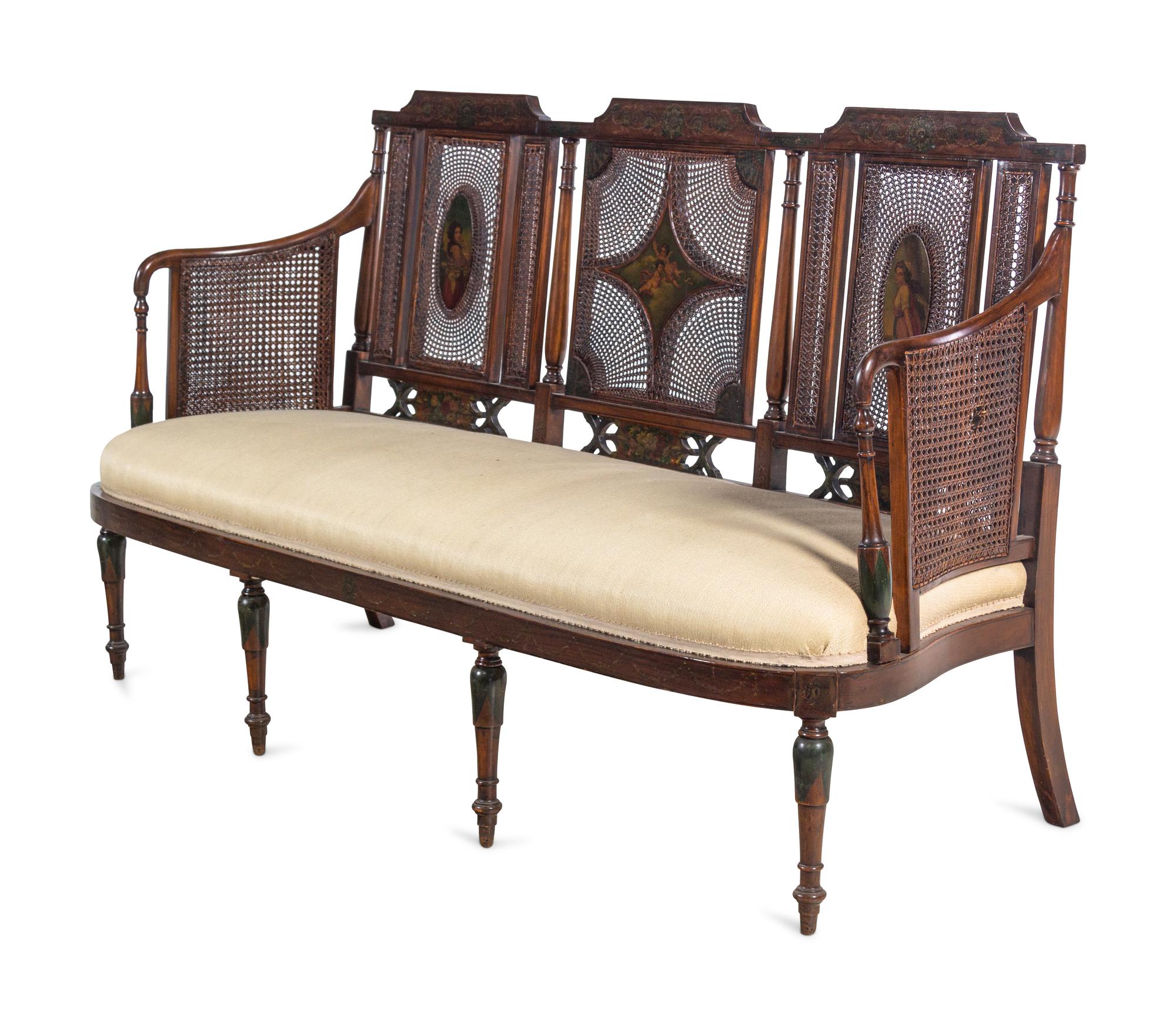 An Edwardian Painted Satinwood Caned Settee