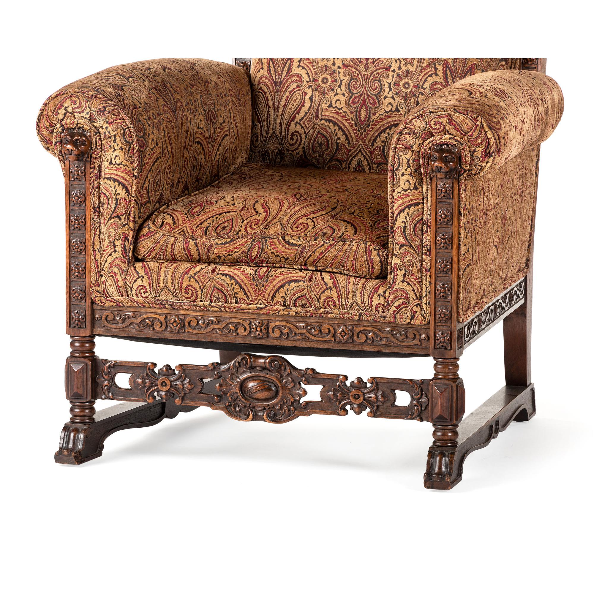 A Jacobean Style Carved Oak Sofa and Armchair