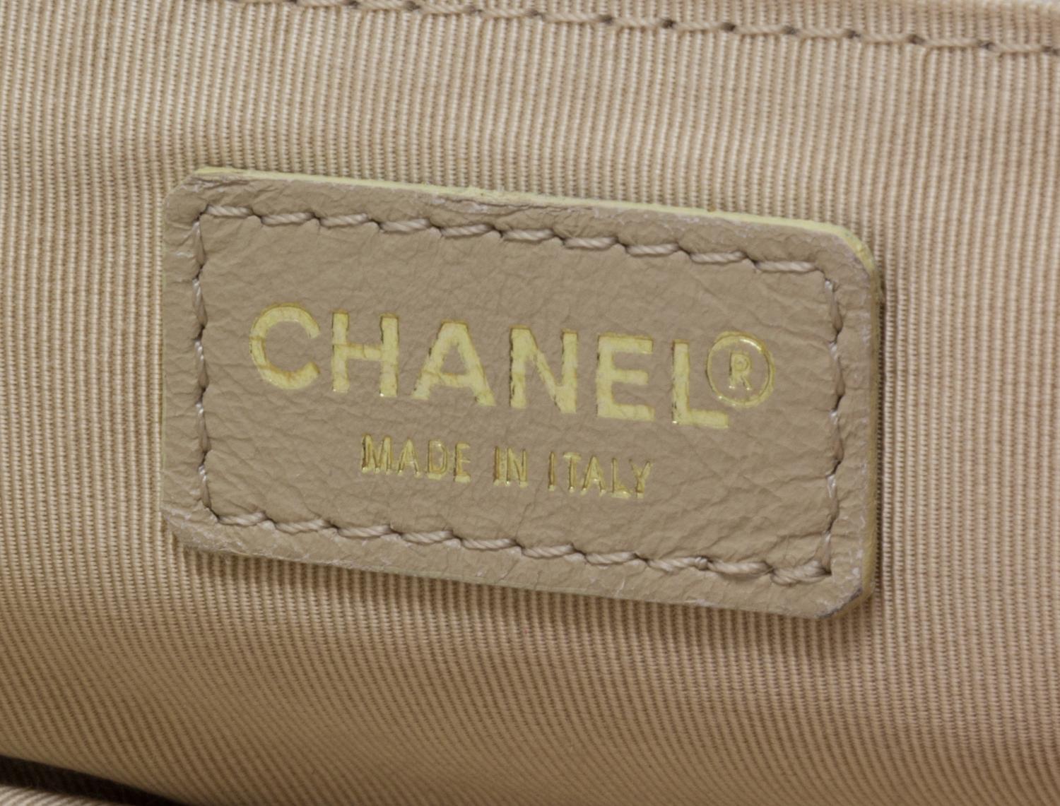 A Chanel Cream Caviar Leather Quilted Backpack, 12"x 10" x 3".