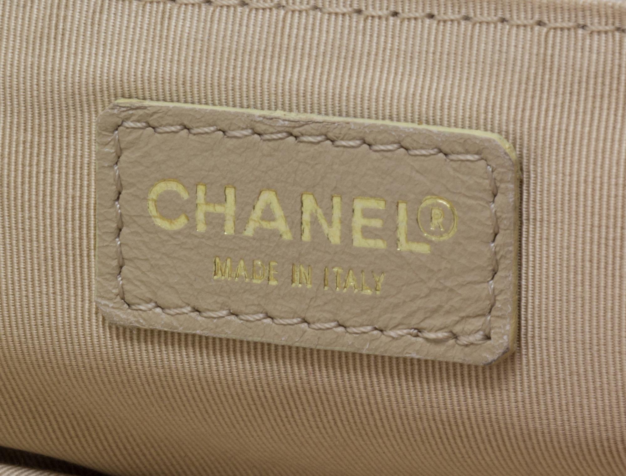 A Chanel Cream Caviar Leather Quilted Backpack, 12"x 10" x 3".