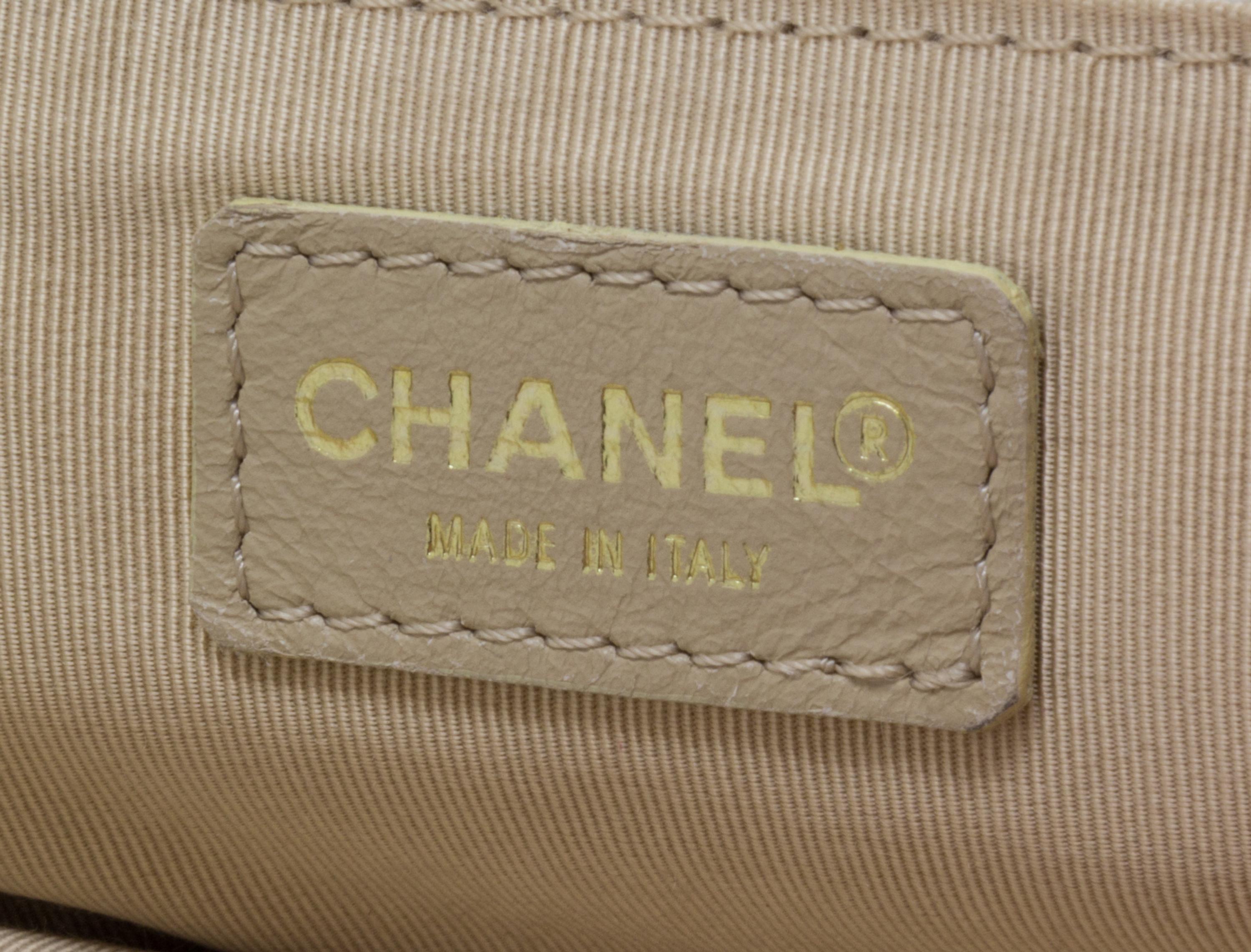 A Chanel Cream Caviar Leather Quilted Backpack, 12"x 10" x 3".
