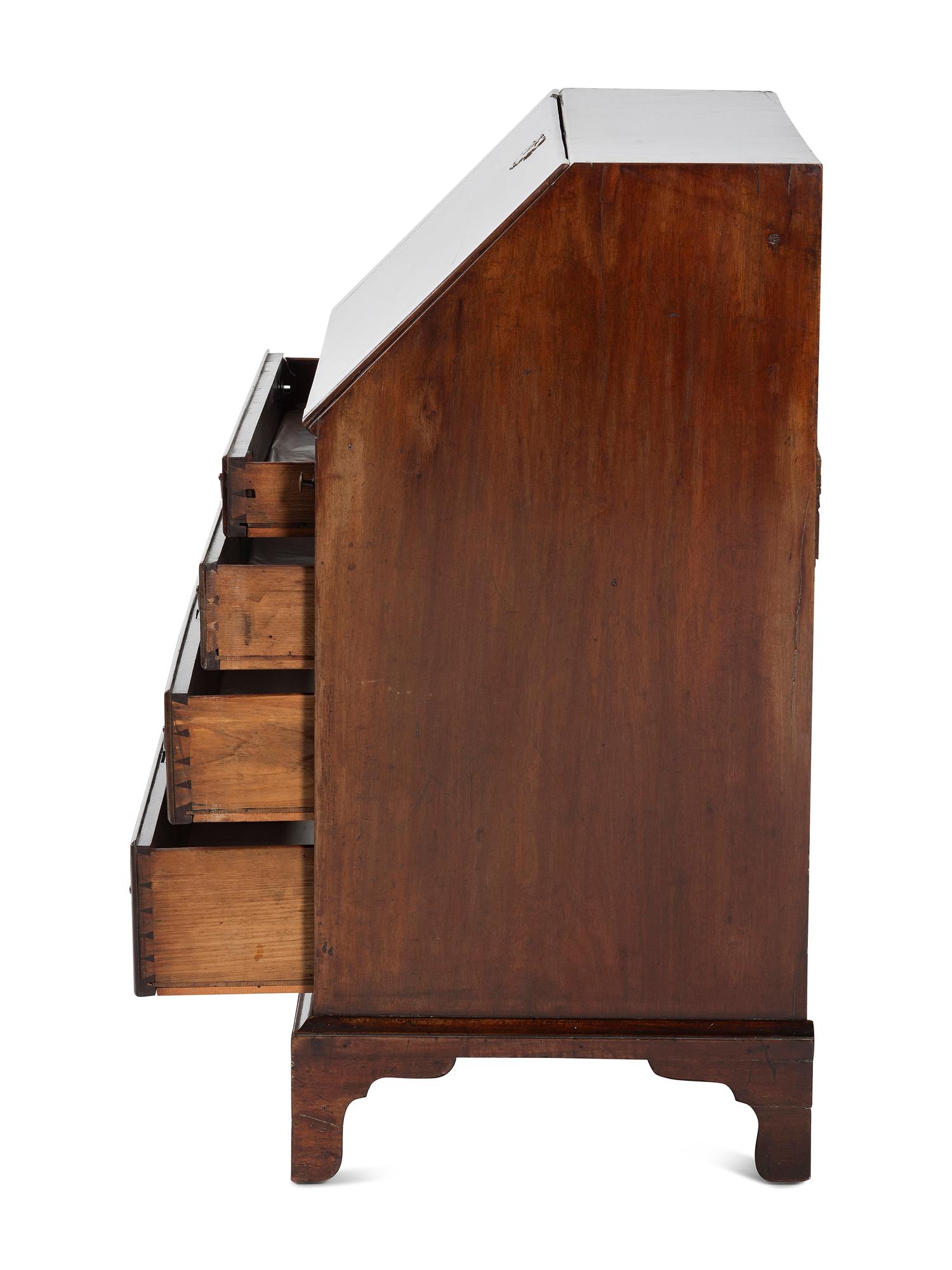 A Chippendale Figured and Shell-Carved Mahogany Slant Front Desk